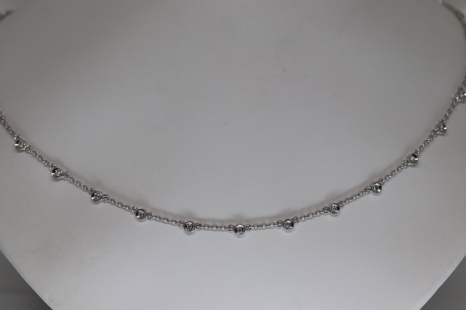 18KT Diamond By The Yard Necklace: A ladies 18kt Diamond By The Yard necklace. This beautiful diamond necklace has a total of 30 round brilliant diamonds. The diamonds are VS1-VS2 clarity. The necklace legnth is about 18in. Total diamo