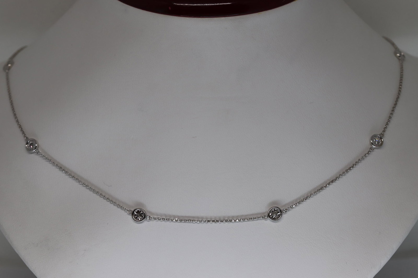 Diamond By The Yard Necklace: A ladies Diamond By The Yard ladies necklace. This necklace has a total of 9 roound brilliant diamonds. The diamonds weight is 0.25tcw. The length of the necklace is 20in. The diamodns are set on the 