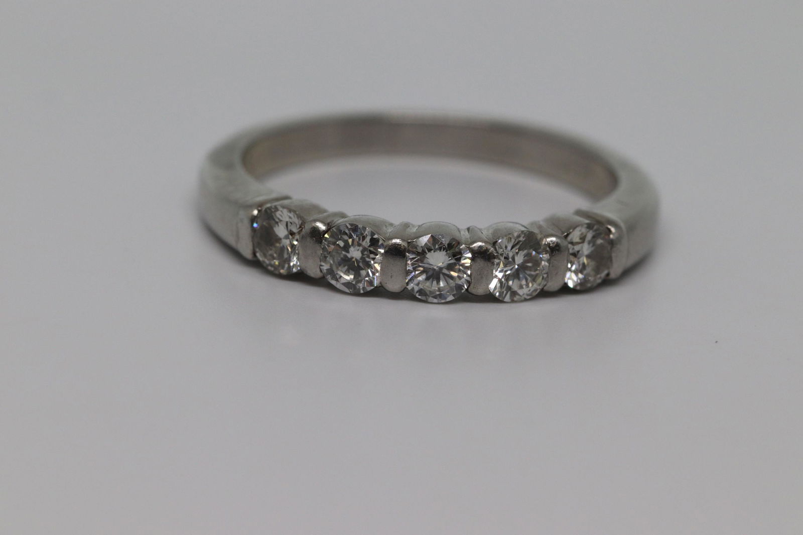 Platinum Diamond Ring: This is a Beautuiful Platinum Diamond ring with 5 Diamonds. The ring can be worn for a wedding band. The ring size 5.00. SKU: DHQ0XO