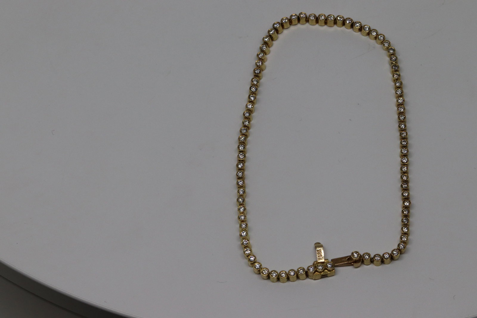 18kt Diamond Bracelet: A Ladies 18Kt yellow Gold diamond bracelet. The bracelet has a total of 80 round brilliant diamonds. The diamonds are VS1-VS2 clarity, G-H color. Diamond weights: approx 1.00tcw.Length: 6.50in. Total 