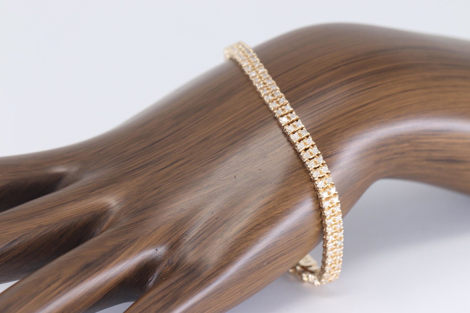 14Kt Ladies Diamond Bracelet: A gorgeous 14kt Yellow Gold Diamond Bracelet. The bracelet has diamonds weighting 2.00tcw. The length is 7.50in. The bracelet also has a secondary lock. This bracelet has been fully polished. Total we