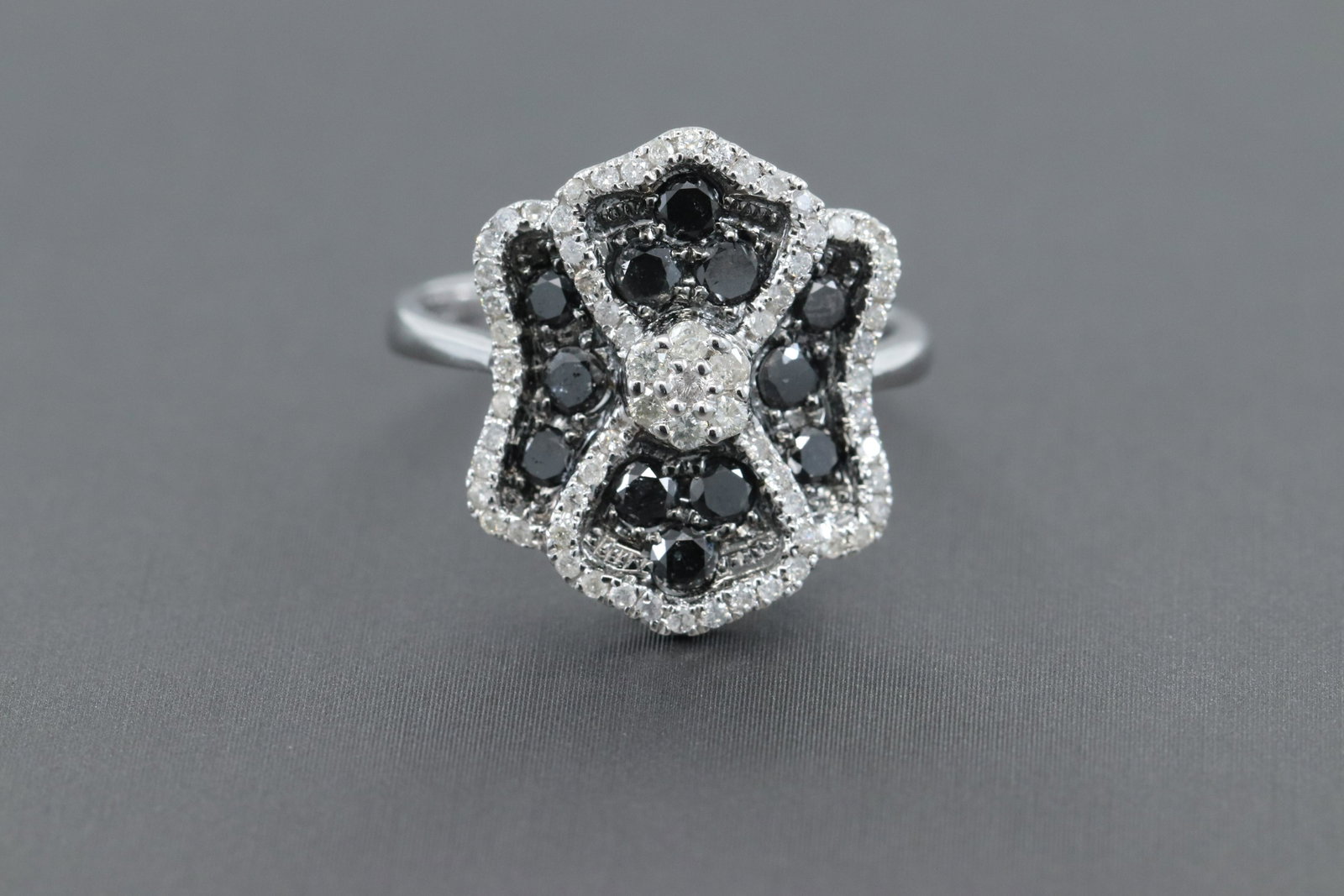 14KT Ladies Diamond Ring: A Beautiful 14kt Whiet Gold Diamond ring. The ring has a total of 1.00tcw in White & Black Diamonds. The diamonds are all round shape diamonds. The ring size is 7.00. This ring is in excellent conditi