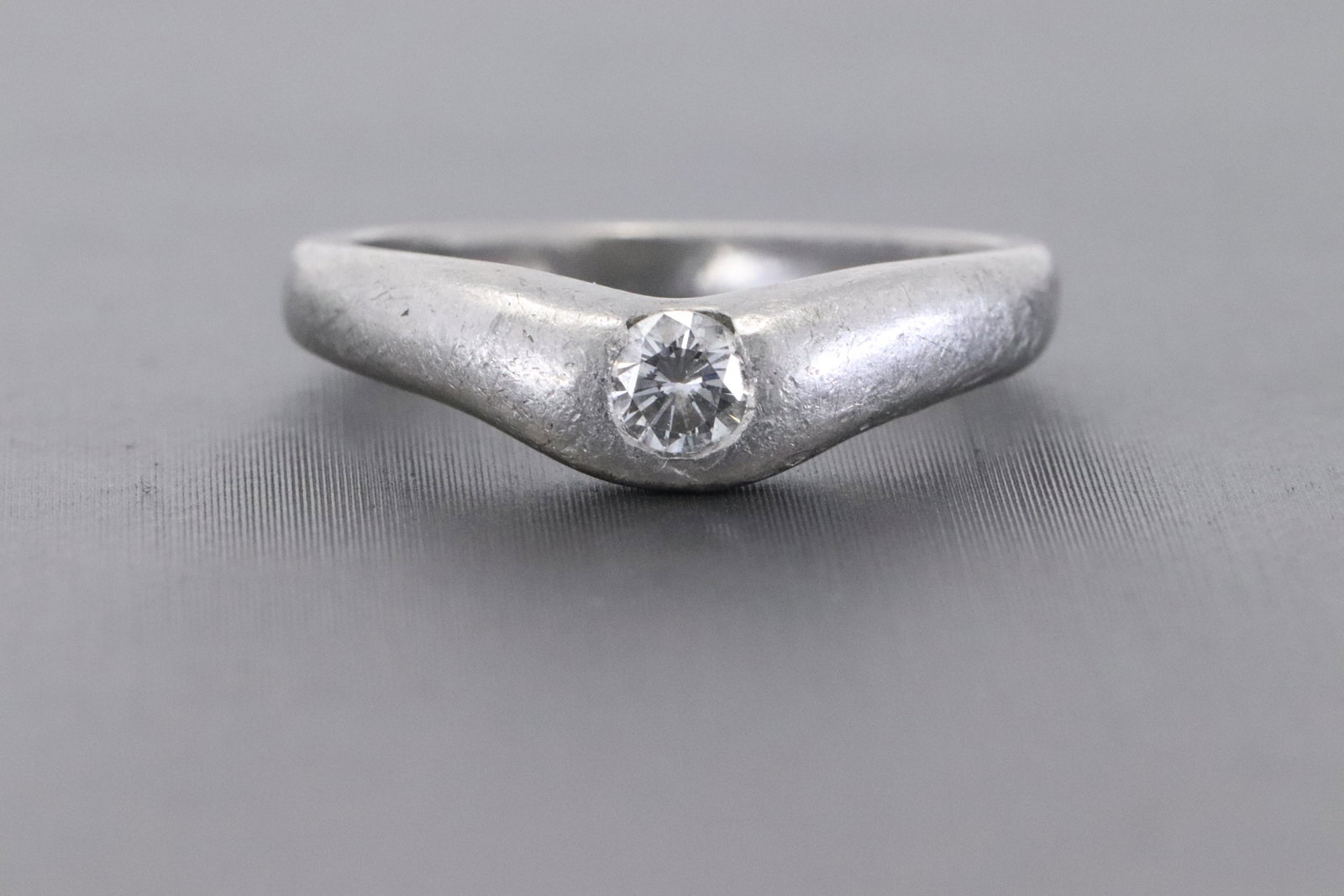 Tiffany & Co Perretti Diamond Platinum Ring: A ladies Tiffany & Co Perretti platinum Diamond ring. The ring has a round brilliant diamond in the center which weighs approx 0.18ct. This Tiffany ring has markings inside " Tiffany & Co PT 950" Ring