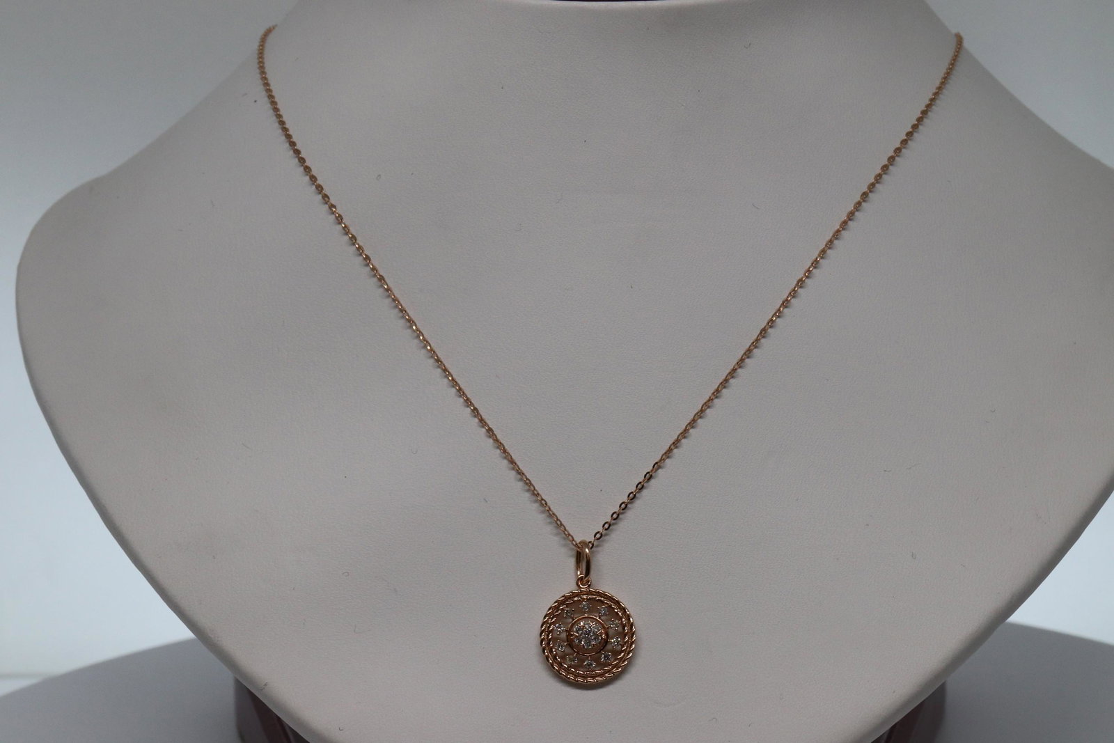 18KT Rose Gold Diamond Necklace: A Gorgeous 18kt Rose Gold Diamond Necklace. The pendant has approx 0.18-0.20tcw in SI-G,H round brilliant diamonds. The necklace can be adjusted in several sizes from 18-21in. Necklace is also 18kt.