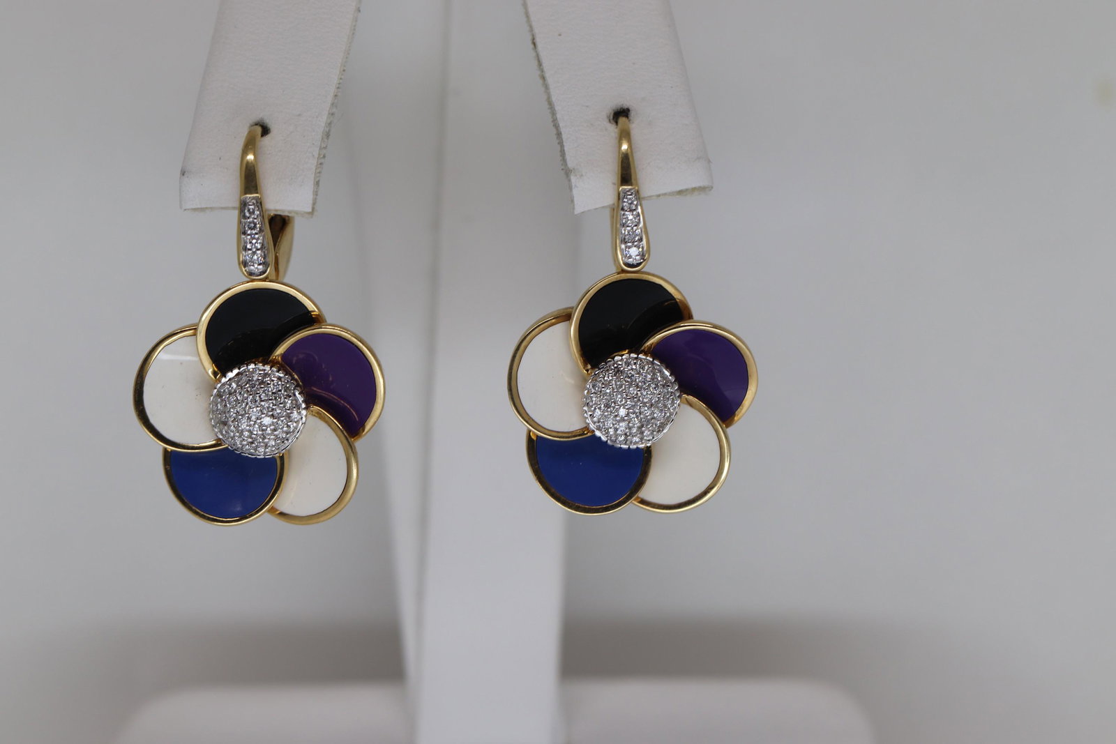 18KT Multi Color Enamel And Diamond Flower Drop: A beautiful pair of 18kt Yellow Gold diamond earrings we made by Italian Designer Rosato. The earrings featured with Blue, White, Black and Purple Enamel. The earrings has a total weight of approx 0.3
