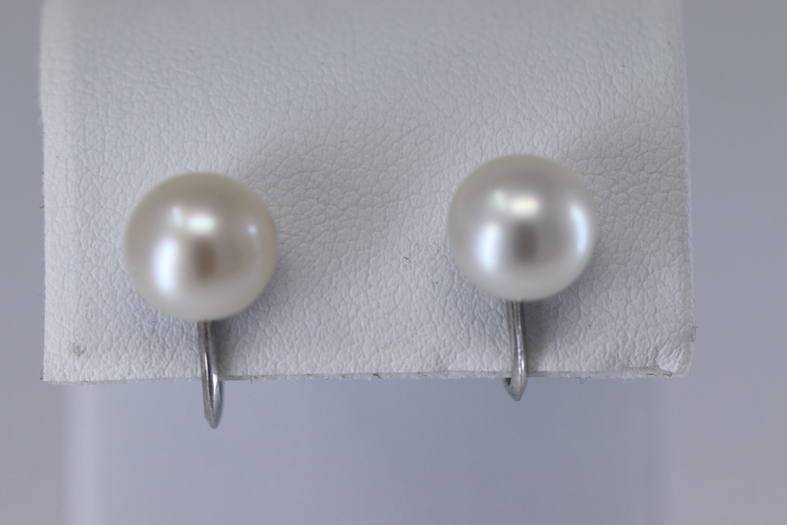 14Kt Pearl Earrings (Omega Backing style): A ladies 14kt White Gold Pearl earrings. The Pearls measure: about 8.50mm each. Length 0.75". SKU02NDYEPWQ8