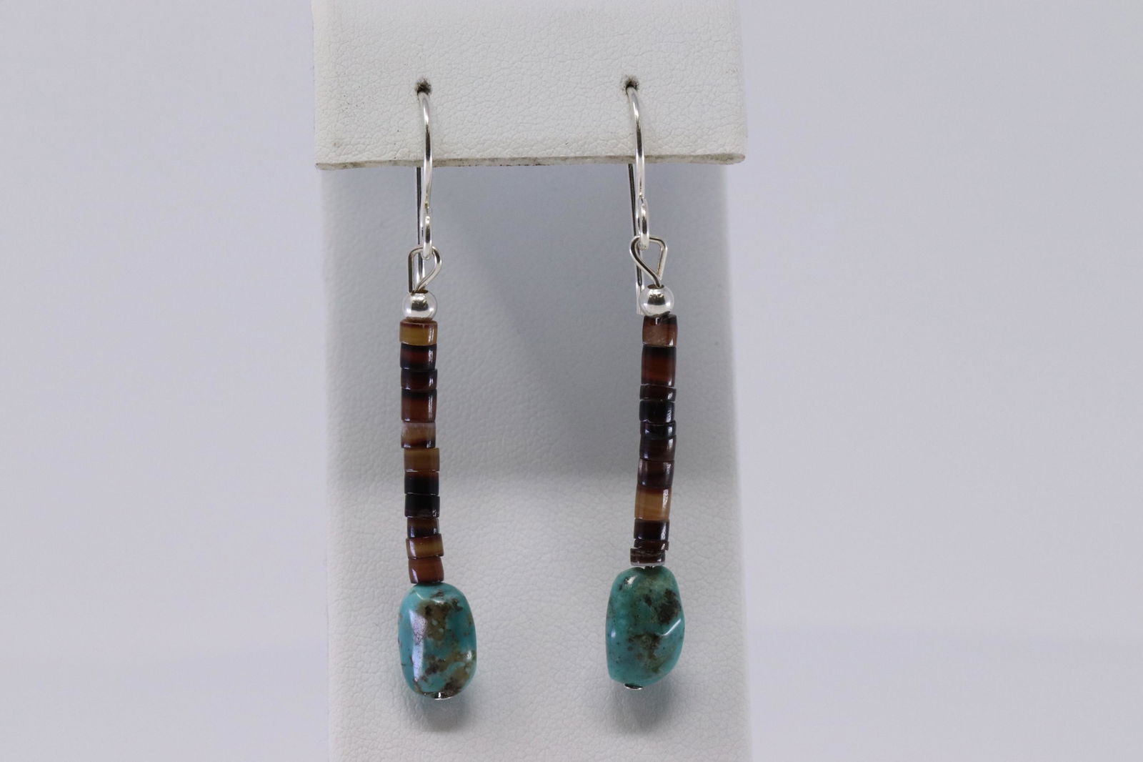 Navajo earrings are strung with penshell heishi with a (1 of 2)