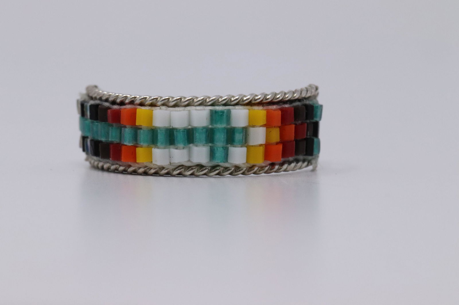 Navajo Sterling Silver Ring.: This is a sterling silver navajo ladies ring. This ring has multi color beads. Ring size is 6.50.