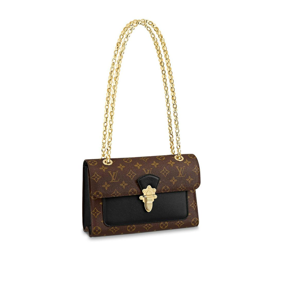 LOUIS VUITTON VICTOIRE: A pre-owned Louis Vuitton Victoire chain bag pairs Monogram canvas. The golden clasp is modeled on the lock of classic Louis Vuitton luggage, while the sliding chain strap echoes the Malletage print t