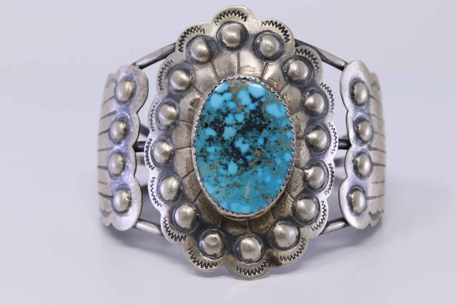 Navajo Handmade Sterling Silver Turquoise Stamp: This is a Navajo Handmade Sterling Silver Turquoise Stamp Bracelet By Tim Yazzie