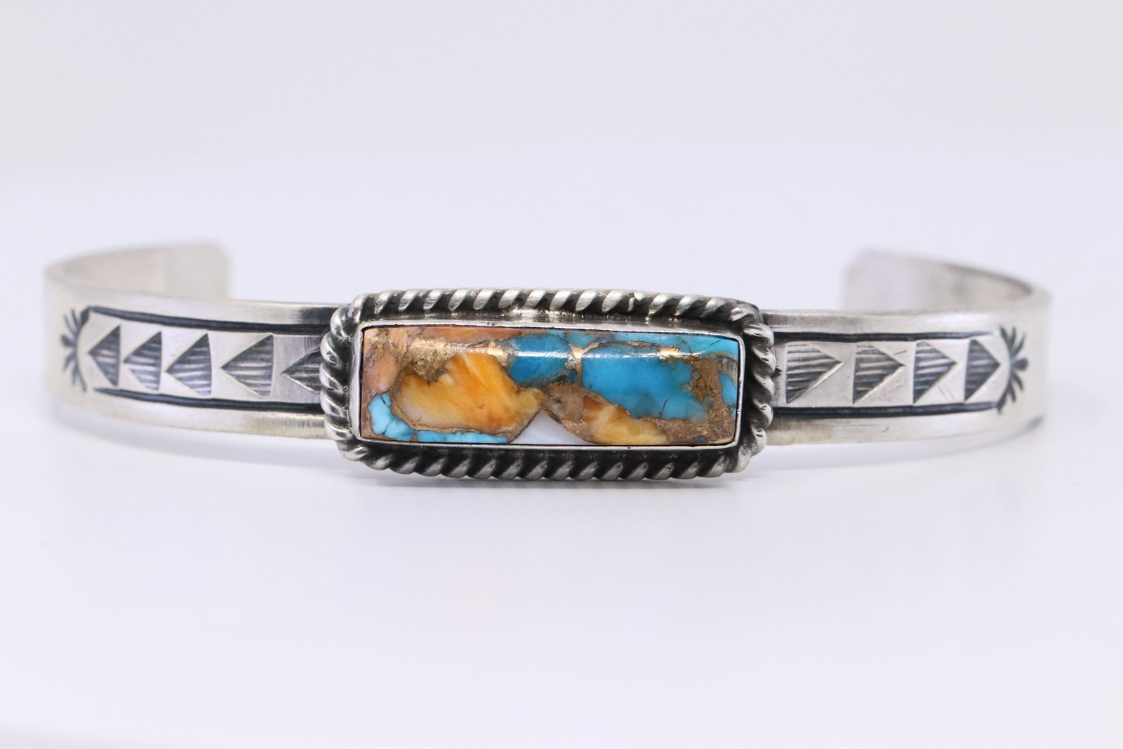 Navajo Handmade Sterling Silver Spiny Turquoise Bronze: This is a Navajo Handmade Sterling Silver Spiny Turquoise Bronze Multi Bracelet By Rick Enriquez.