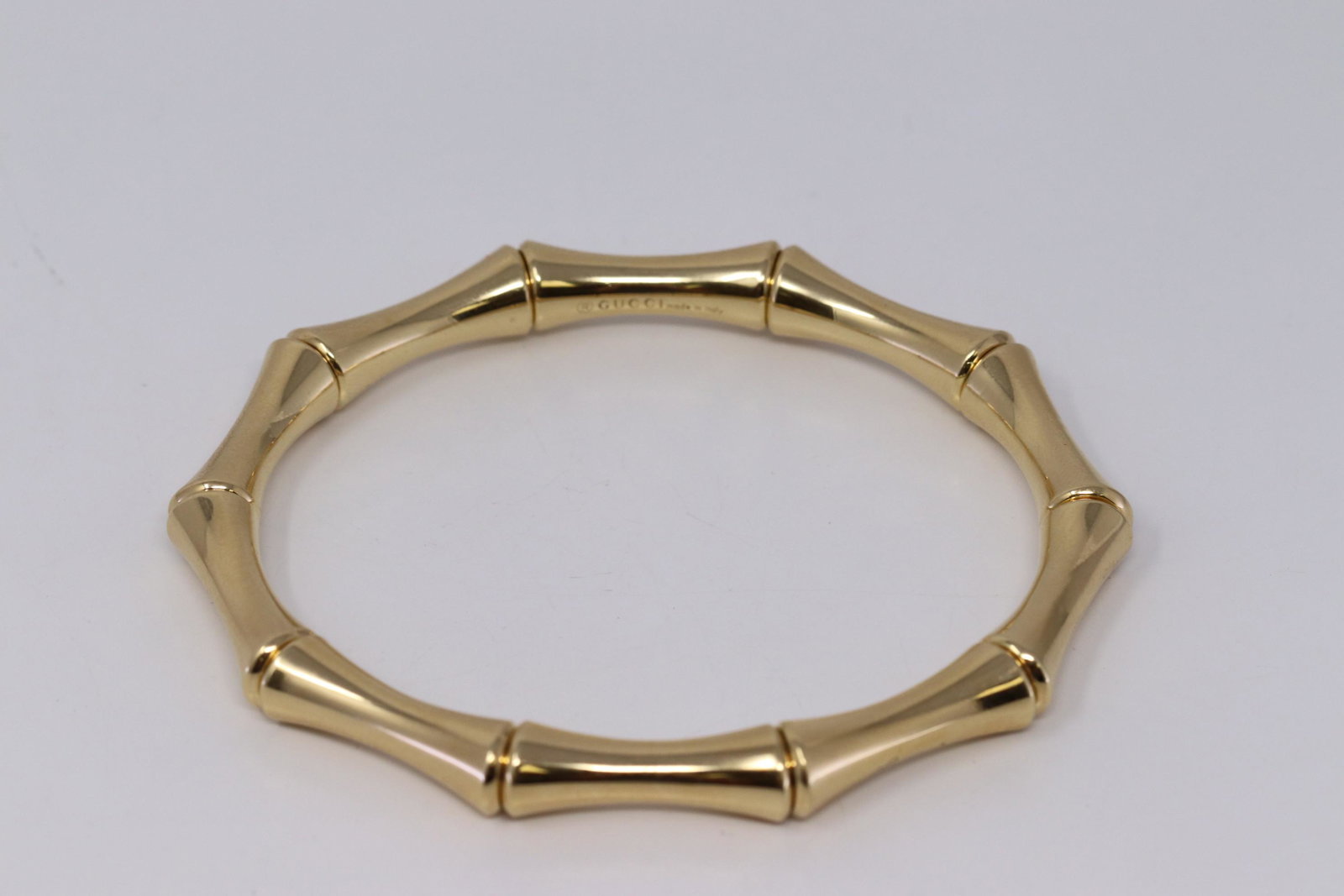 Gucci 18 KYG Bamboo Stretch Bangle Bracelet: Gucci 18 KYG Bamboo Stretch Bangle Bracelet. Size 18 as marked inside.The internal spring mechanism allows the bracelet to stretch over the hand easily onto the wrist. All the right markings â€œGu