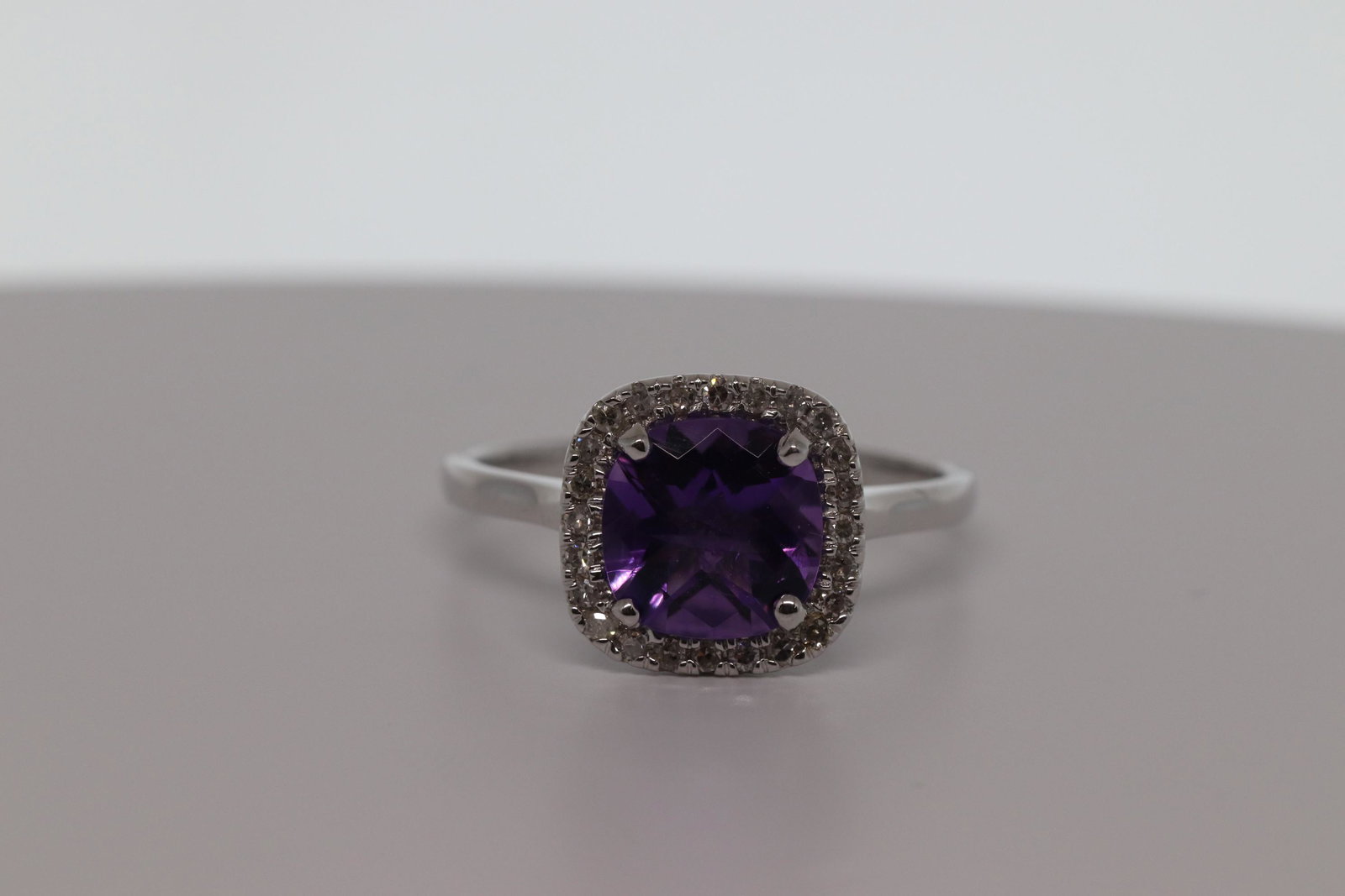 1.84ct Cushion Amethyst & Pave Diamond 14k White Gold: 1.84ct Cushion Amethyst & Pave Diamond 14k White Gold Halo Solitaire Ring. Product Type:Solitaire with accentsRing Size:7Gender:LadiesResizable:YesWidth:11 mmCarat Total Weight:1.84Condition : EXCELLE