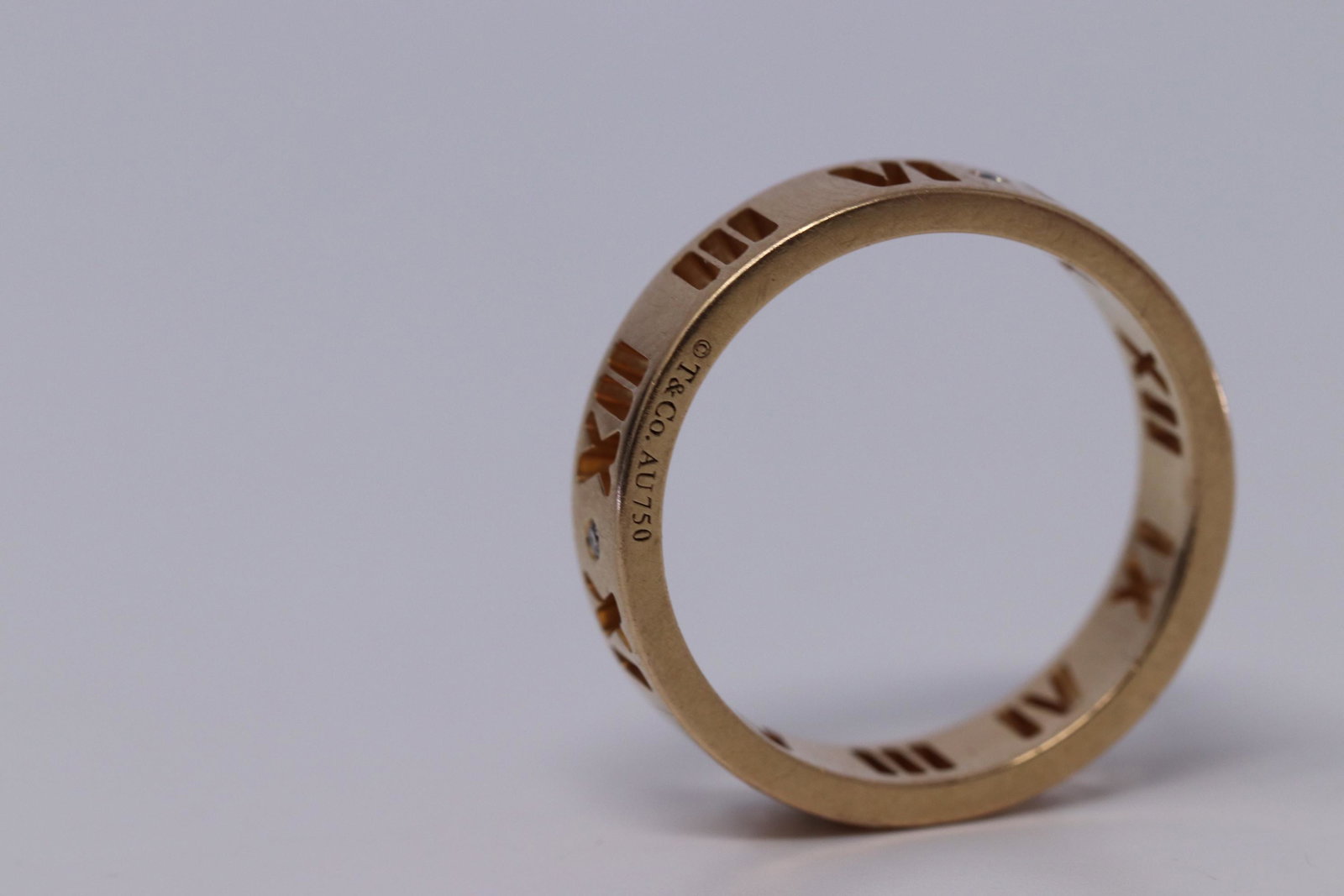 TIFFANY & CO 18K Rose Gold Diamond Atlas Roman: TIFFANY & CO 18K Rose Gold Diamond Atlas Roman No.: Pierced Ring Band Size 6.25. Condition is Pre-owned. Metal Purity: 18kt Rose Gold.