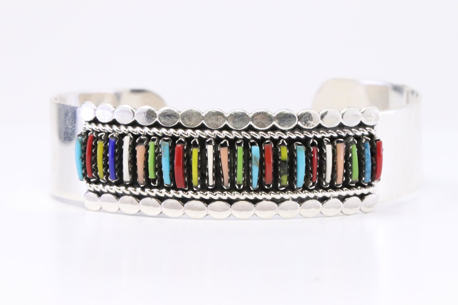 Navajo handmade Sterling Silver Multi-color Needlepoint: This is a Navajo handmade Sterling Silver Multi-color Needlepoint Bracelet By Jason Yazzie