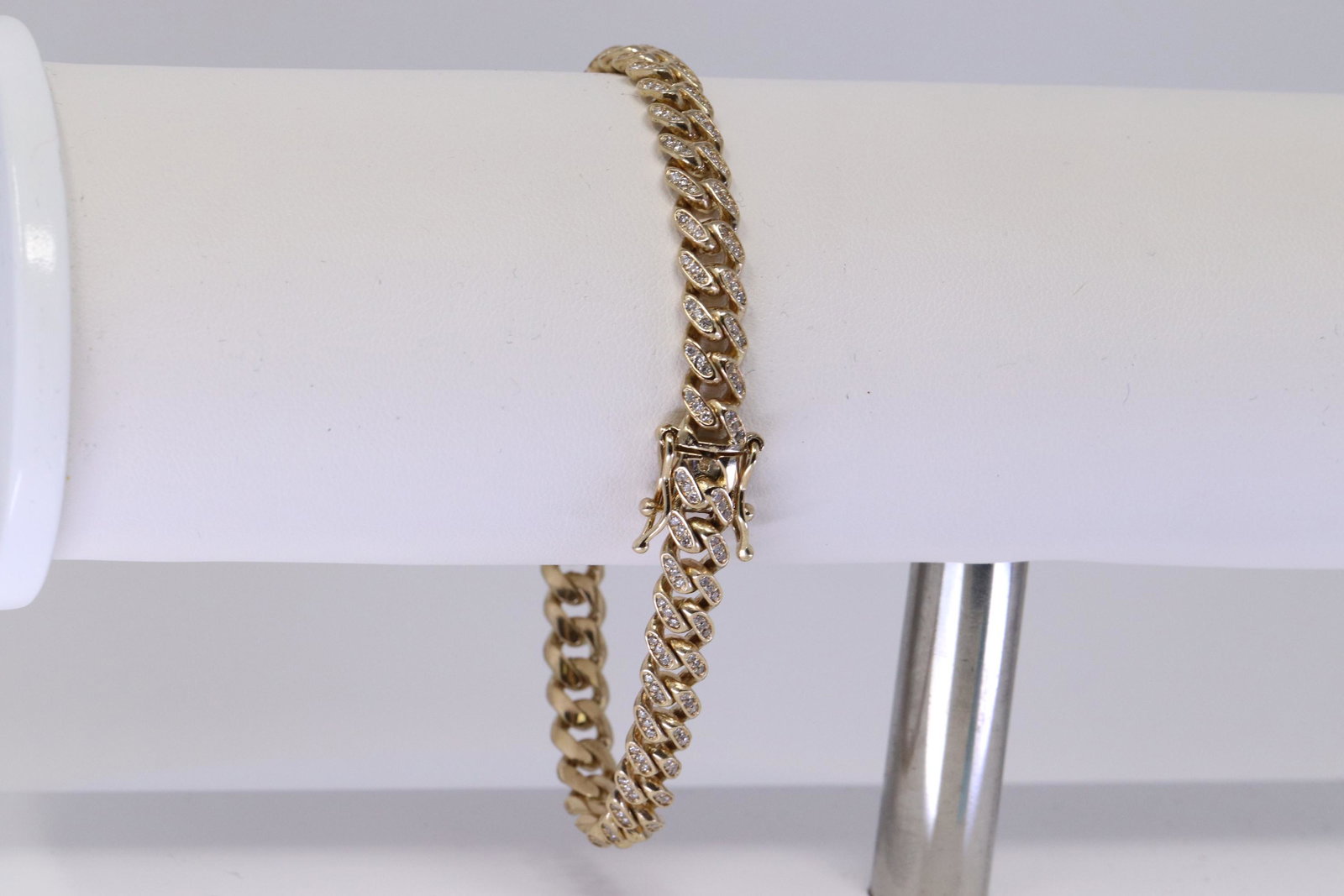 14kt Diamond Cuban Link Bracelet: A 14kt Yellow Gold Diamond Cuban Link bracelet. Bracelet has a total of 270 round diamonds. Diamonds weight approx 3.50cttw. Length: 8.00in. Total weight: 25.80 grams.