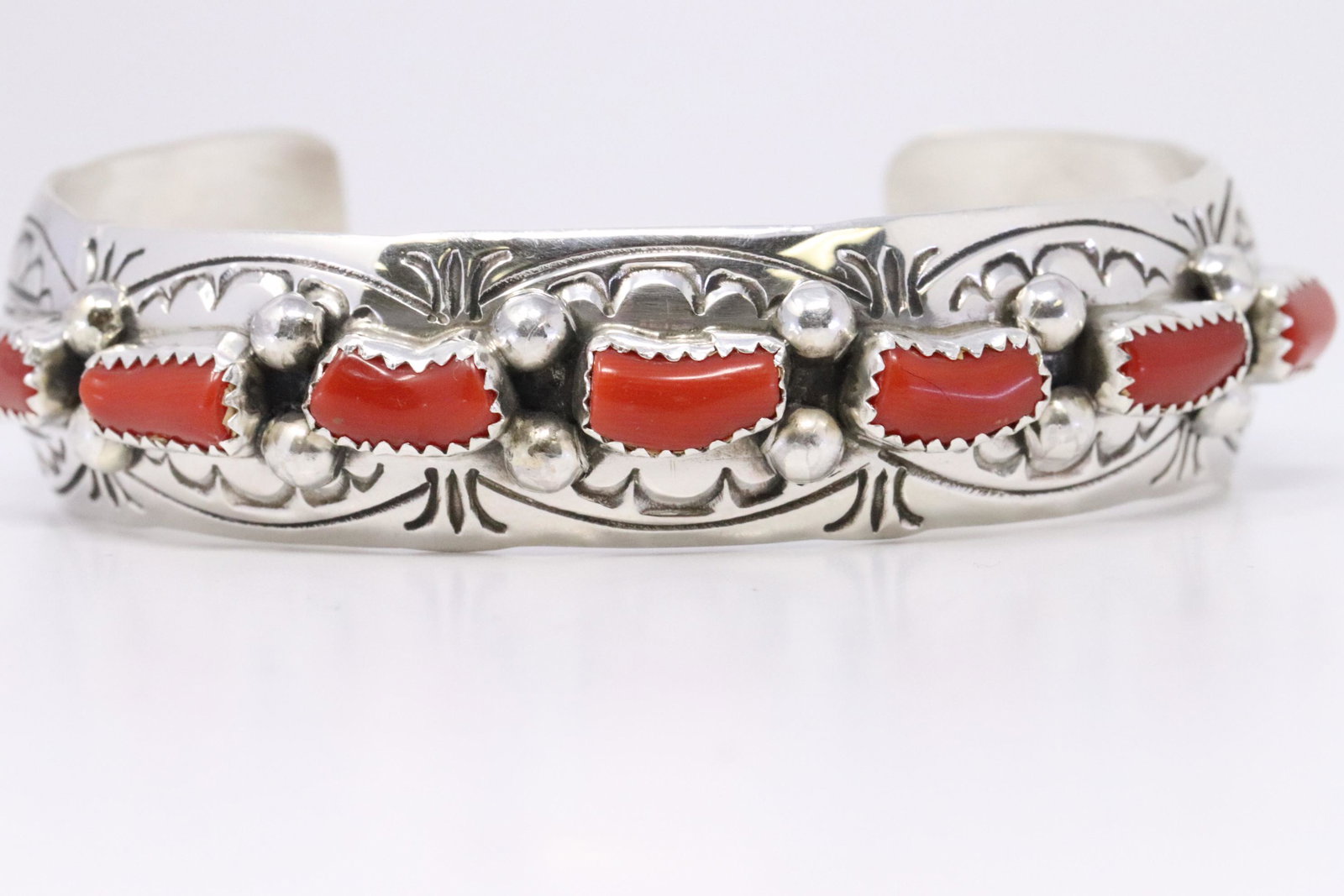 Native American Handmade Navajo Sterling Silver Coral: This is a Native American Handmade Navajo Sterling Silver Coral Bracelet by Grace Silver. Bracelet Measurement inside is 6.00in