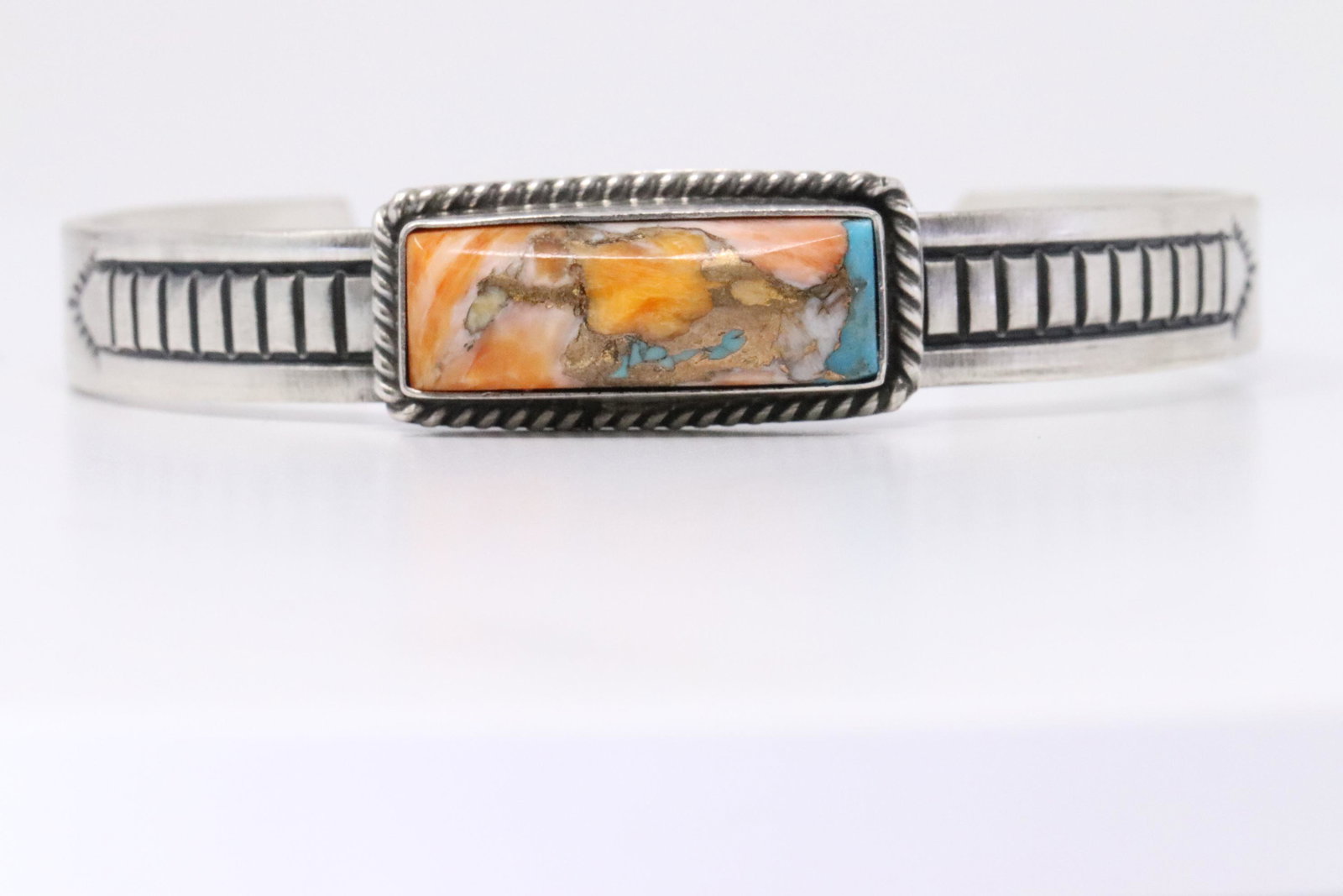 Native American Navajo Handmade Sterling Silver Spiny: This is a Native American Navajo Handmade Sterling Silver Spiny Turquoise Bronze Mix Bracelet by Rick Enriquez. Bracelet Measurement inside is 5.50in