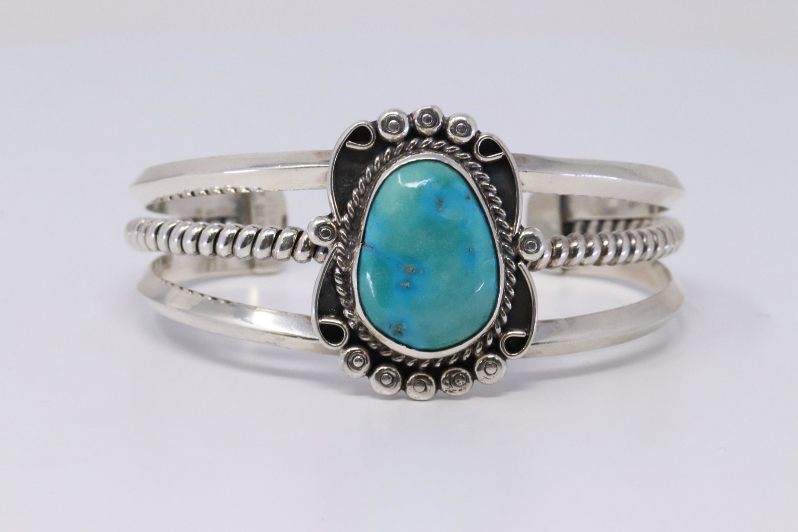 Native American Navajo Handmade Sterling Silver: This is a Native American Navajo Handmade Sterling Silver Turquoise Stone Size is 2.00mmX1.50mm Bracelet by T. Benally. Bracelet Measurement inside is 5.50in