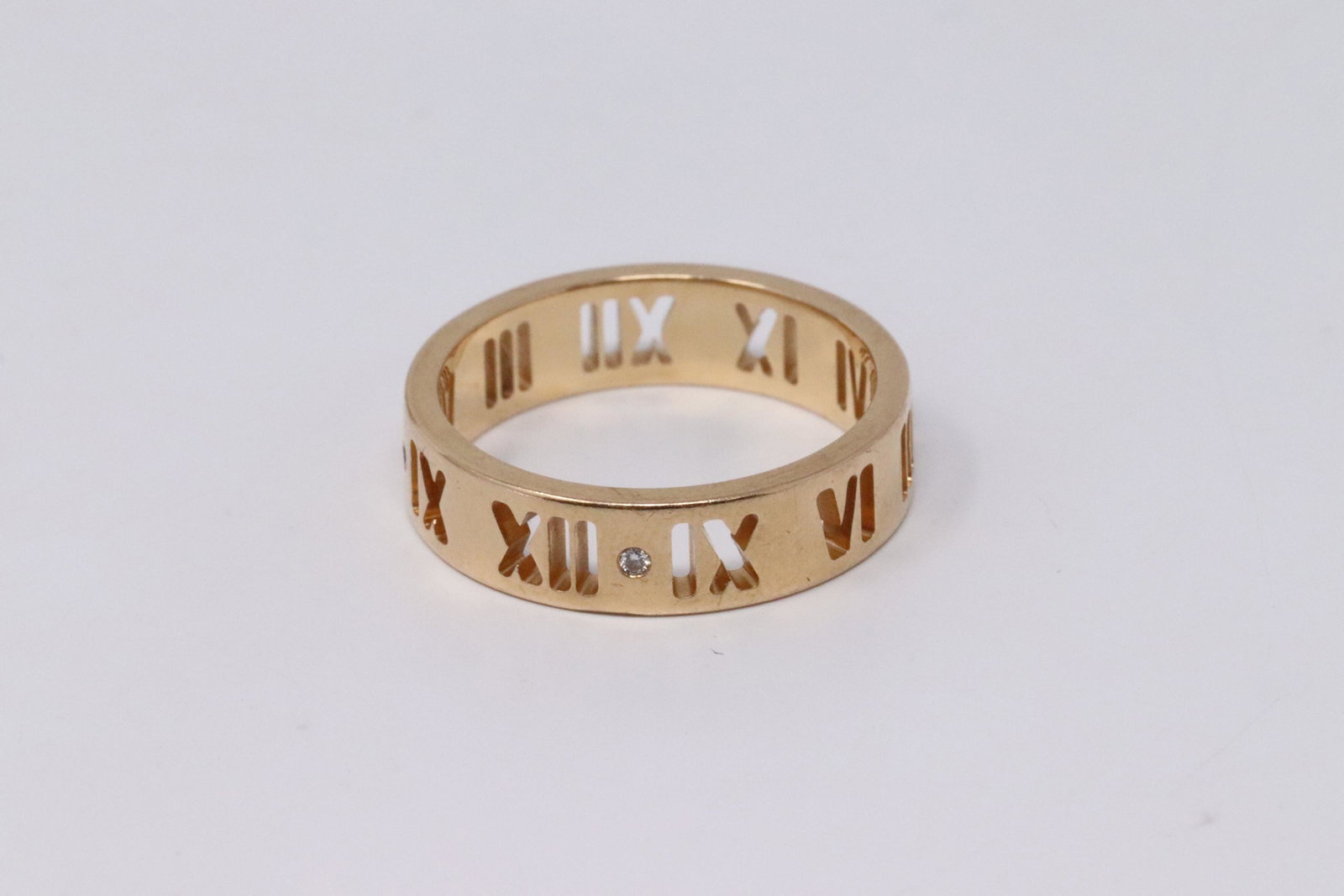 TIFFANY & CO 18K Rose Gold Diamond Atlas Roman: TIFFANY & CO 18K Rose Gold Diamond Atlas Roman No.: Pierced Ring Band Size 6.25. Condition is Pre-owned. Metal Purity: 18kt Rose Gold.