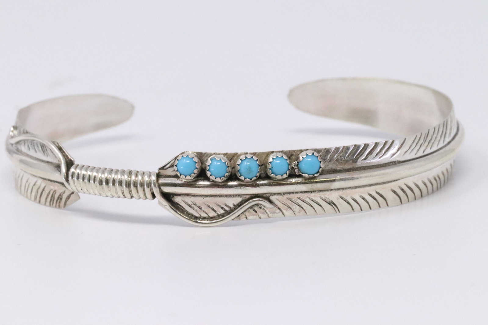 Native American Navajo Handmade Sterling Silver Feather: This is a Native American Navajo Handmade Sterling Silver Feather Turquoise Bracelet by Aaron Davis. Bracelet Measurement inside is 5.50in