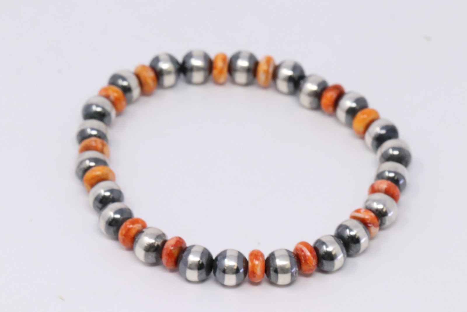 Native American Navajo Handmade Sterling Silver Pearl: This is a Native American Navajo Handmade Sterling Silver Pearl Beaded stretch Spiny Oyster Bracelet.