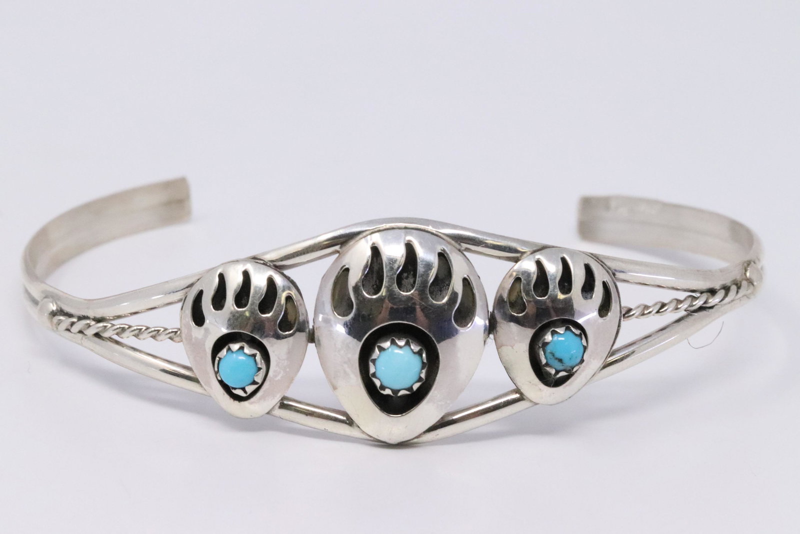 Native American Navajo Handmade Sterling Silver: This is a Native American Navajo Handmade Sterling Silver Turquoise Bear Paw Bracelet by Janice Spencer.