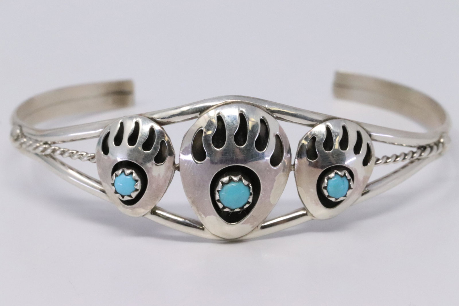 Native American Navajo Handmade Sterling Silver: This is a Native American Navajo Handmade Sterling Silver Turquoise Bear Paw Bracelet by Janice Spencer.