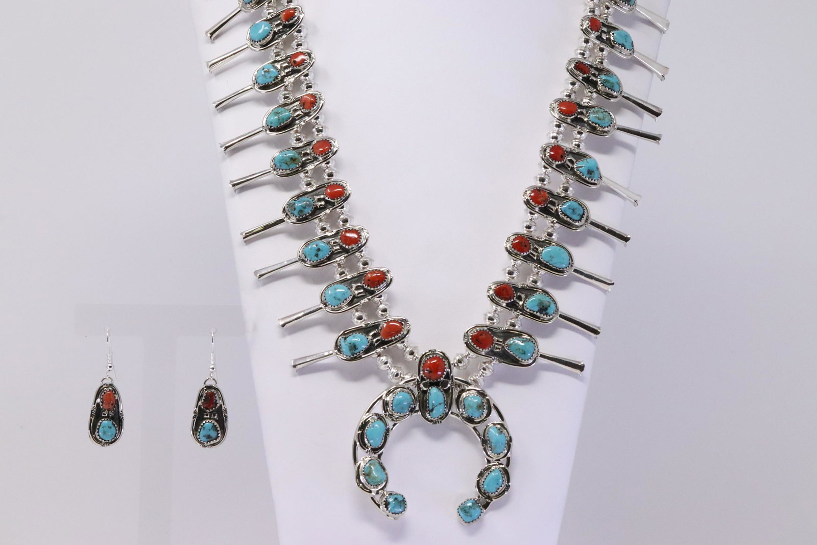 Native American Navajo Handmade Sterling Silver: This is a Native American Navajo Handmade Sterling Silver Turquoise and Coral Squash Blossom Necklace and Earrings Set by Petreena Pinto. Necklace Length is 26.00in"