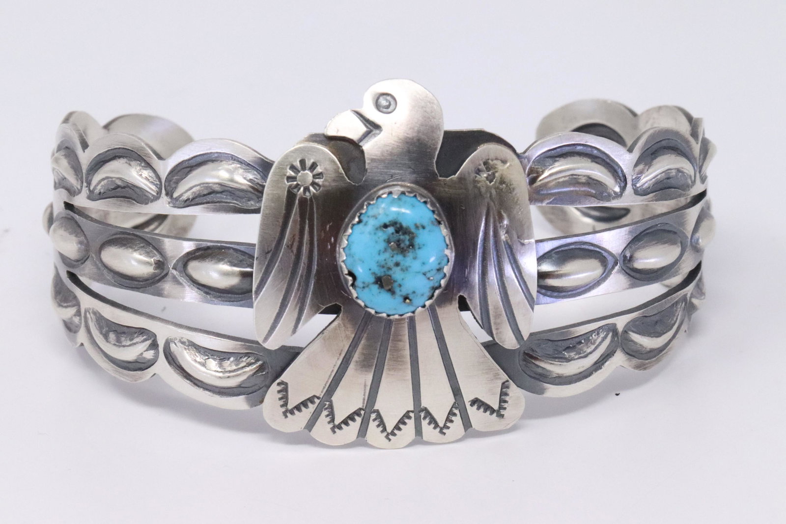 Native American Navajo Handmade Sterling Silver: This is a Native American Navajo Handmade Sterling Silver Turquoise Thunderbird Bracelet by Tim Yazzie.