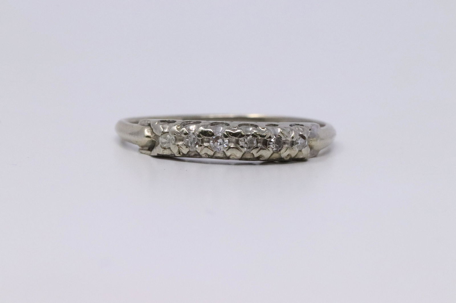 18KT Vintage Diamond Ring: Ladies 18kt White Gold Vintage Diamond ring. Ring has a total of 6 round diamonds. Ring size: 9.00. #AY
