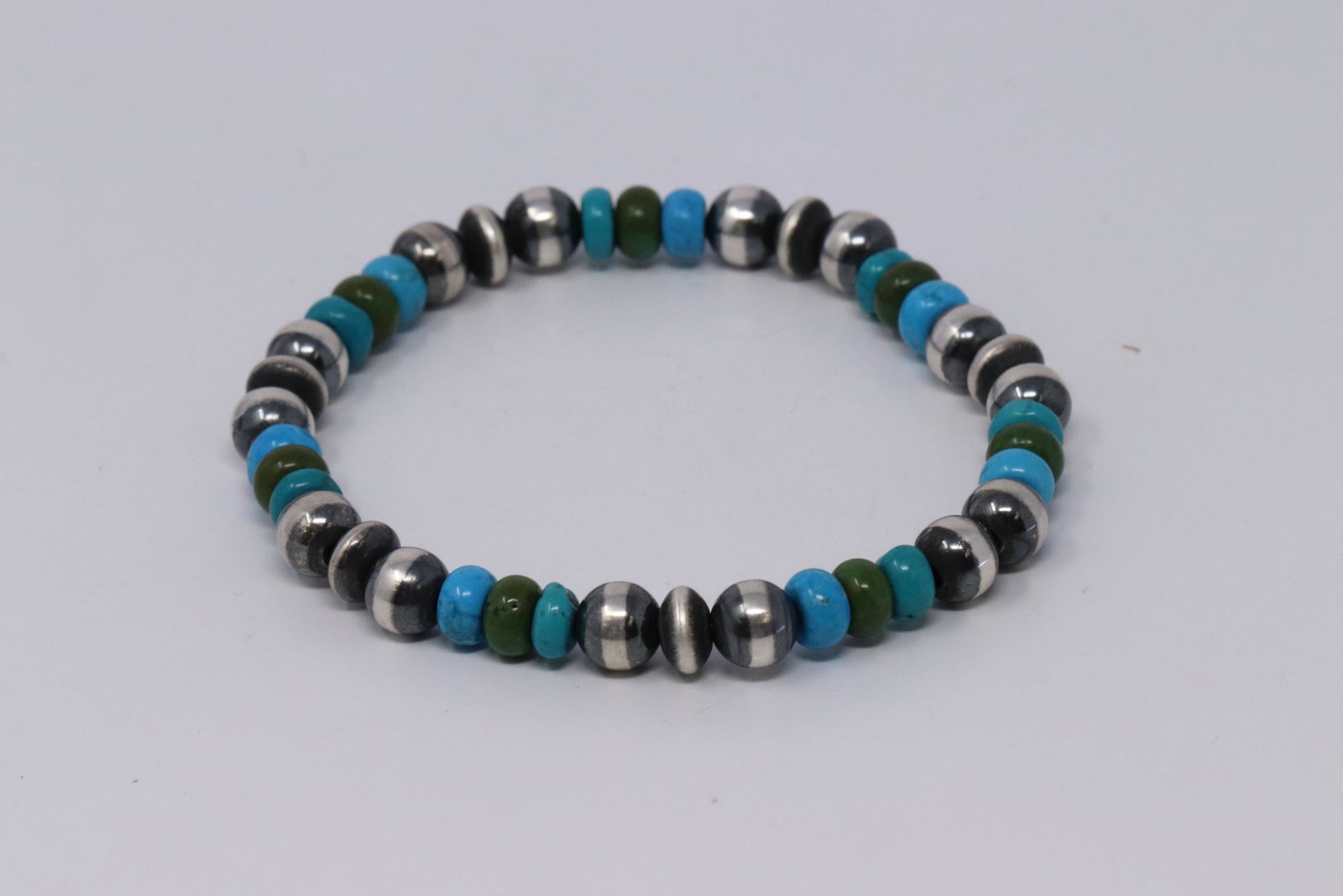 Native American Navajo Handmade Sterling Silver Pearl: This is a Native American Navajo Handmade Sterling Silver Pearl Beaded stretch Turquoise Oyster Bracelet.