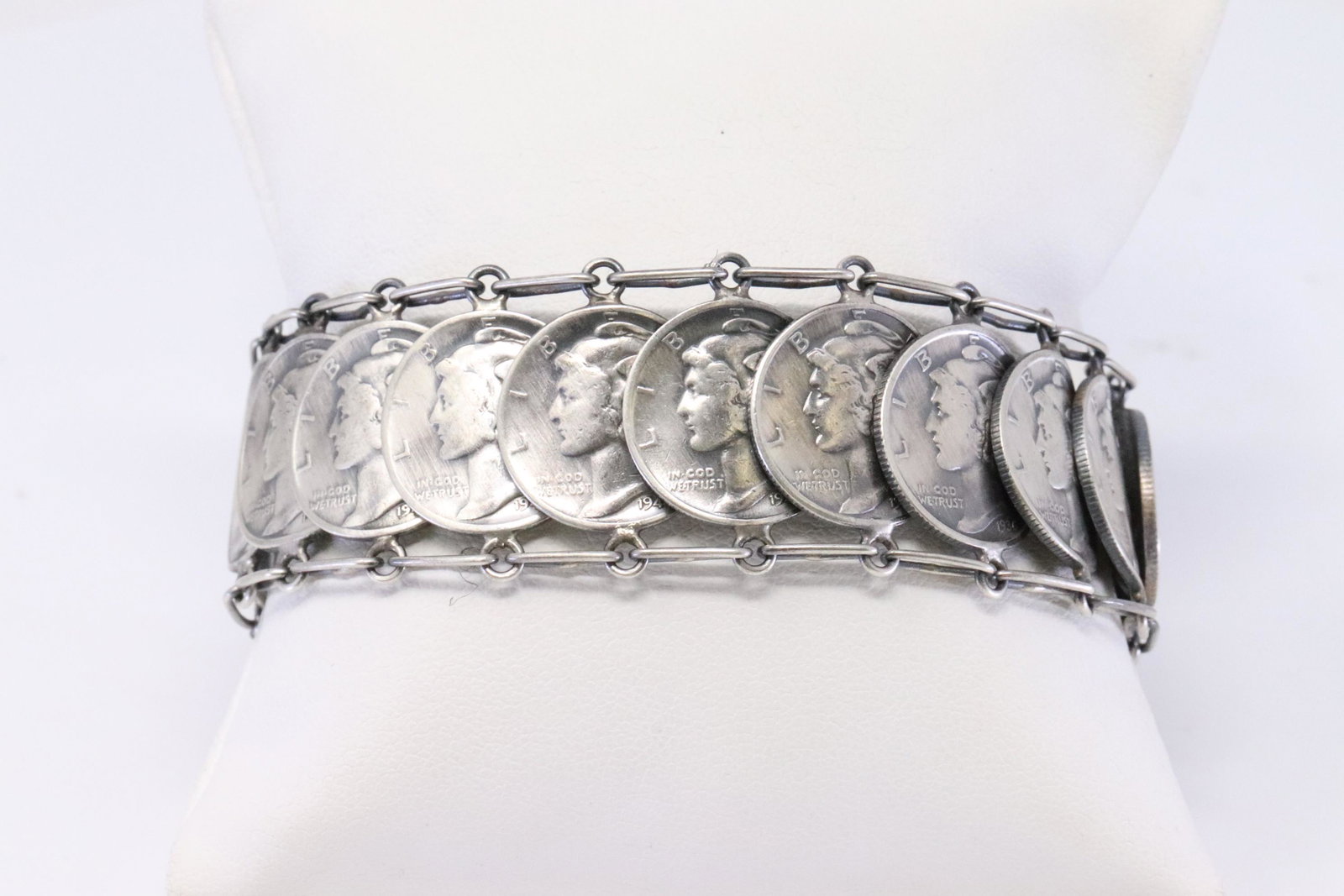 Native American Navajo Handmade Sterling Silver: This is a Native American Navajo Handmade Sterling Silver Turquoise Liberty Dime Bracelet by James Mccabe.