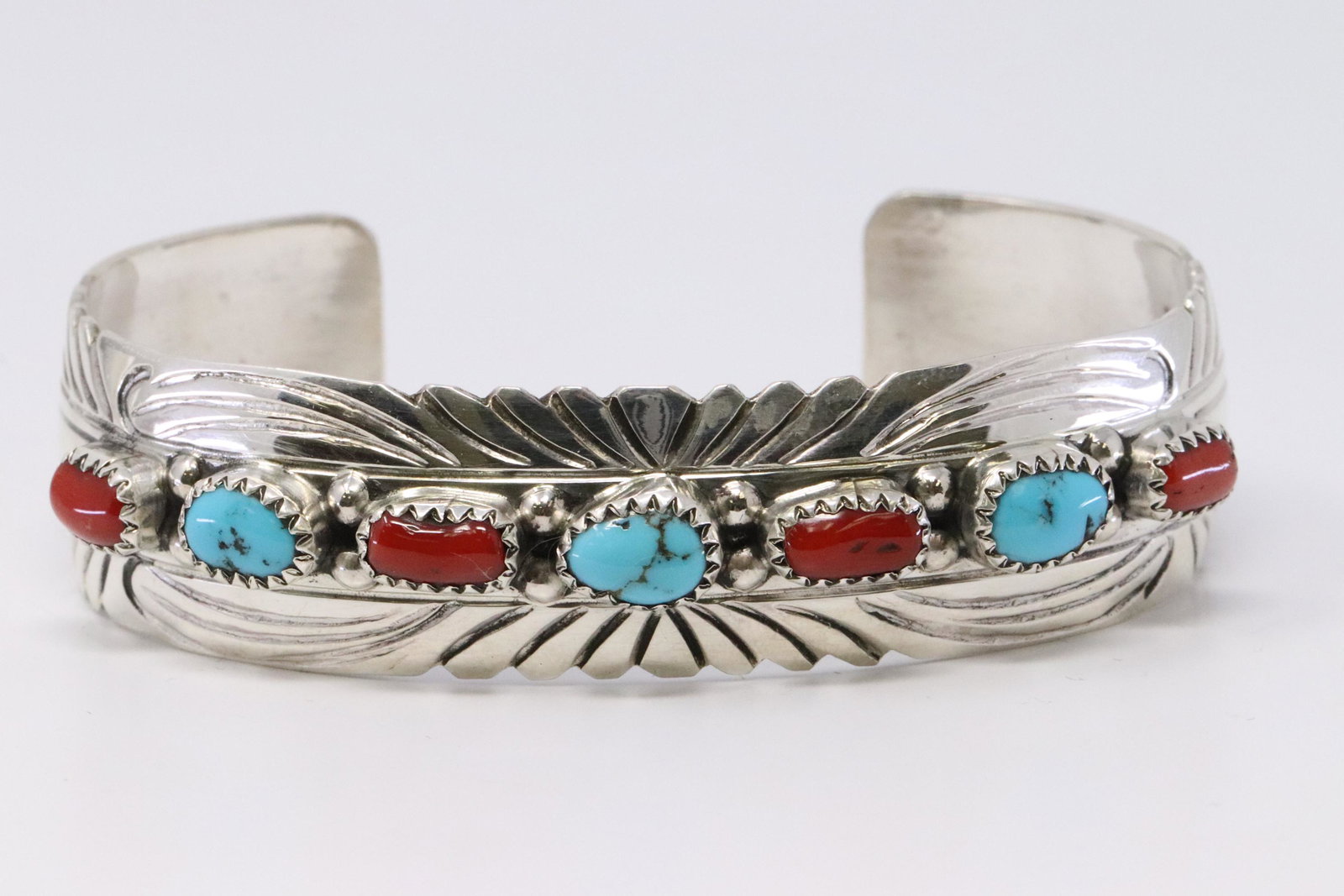 Native American Navajo Handmade Sterling Silver: This is a Native American Navajo Handmade Sterling Silver Turquoise and Coral Bracelet by Julia Slinkey.