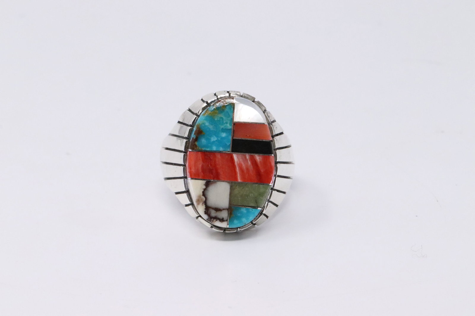 Native American Navajo Handmade Sterling Silver: This is a Native American Navajo Handmade Sterling Silver Multi-Color Inlay Ring by Ray Jack.