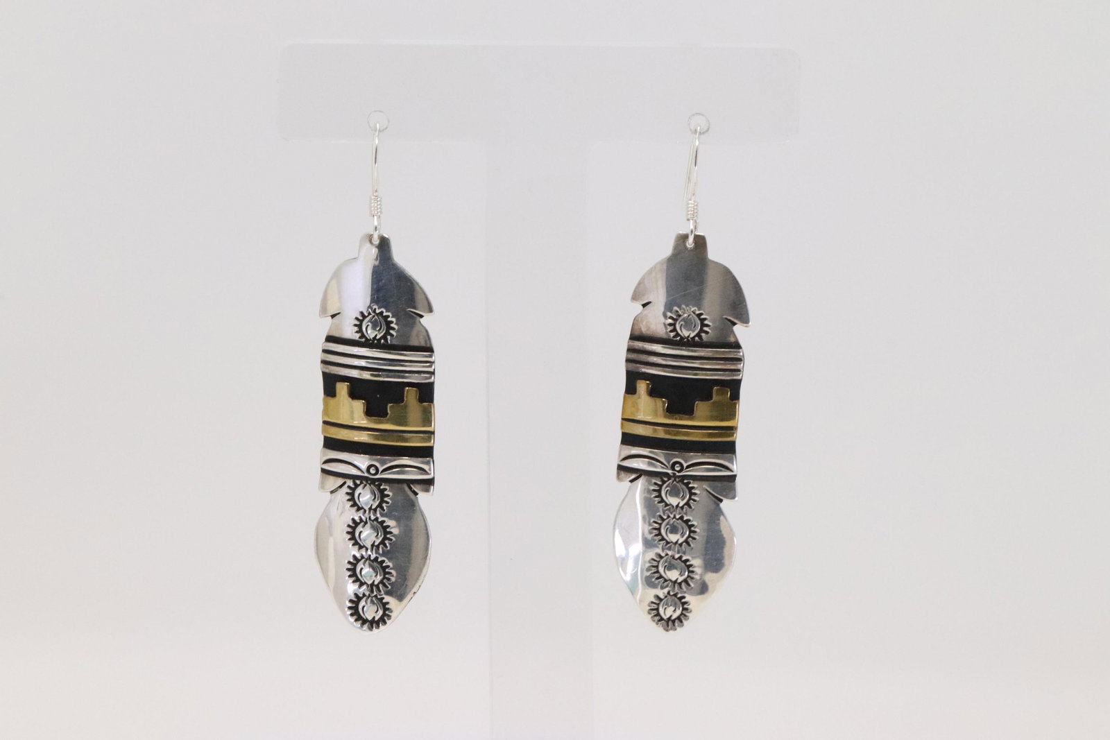 Native American Navajo Handmade Sterling Silver Goal: This is a Native American Navajo Handmade Sterling Silver Goal plated Feather Earrings by T&R Singer.