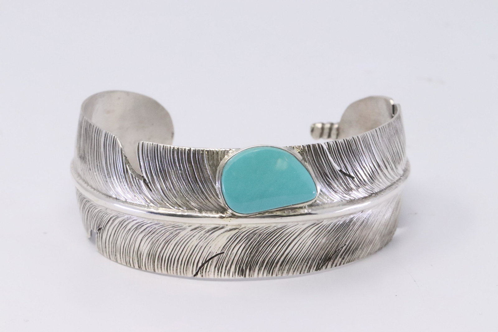 Native American Navajo Handmade Sterling Silver: This is a Native American Navajo Handmade Sterling Silver Turquoise Feather Bracelet by Ben Begay.