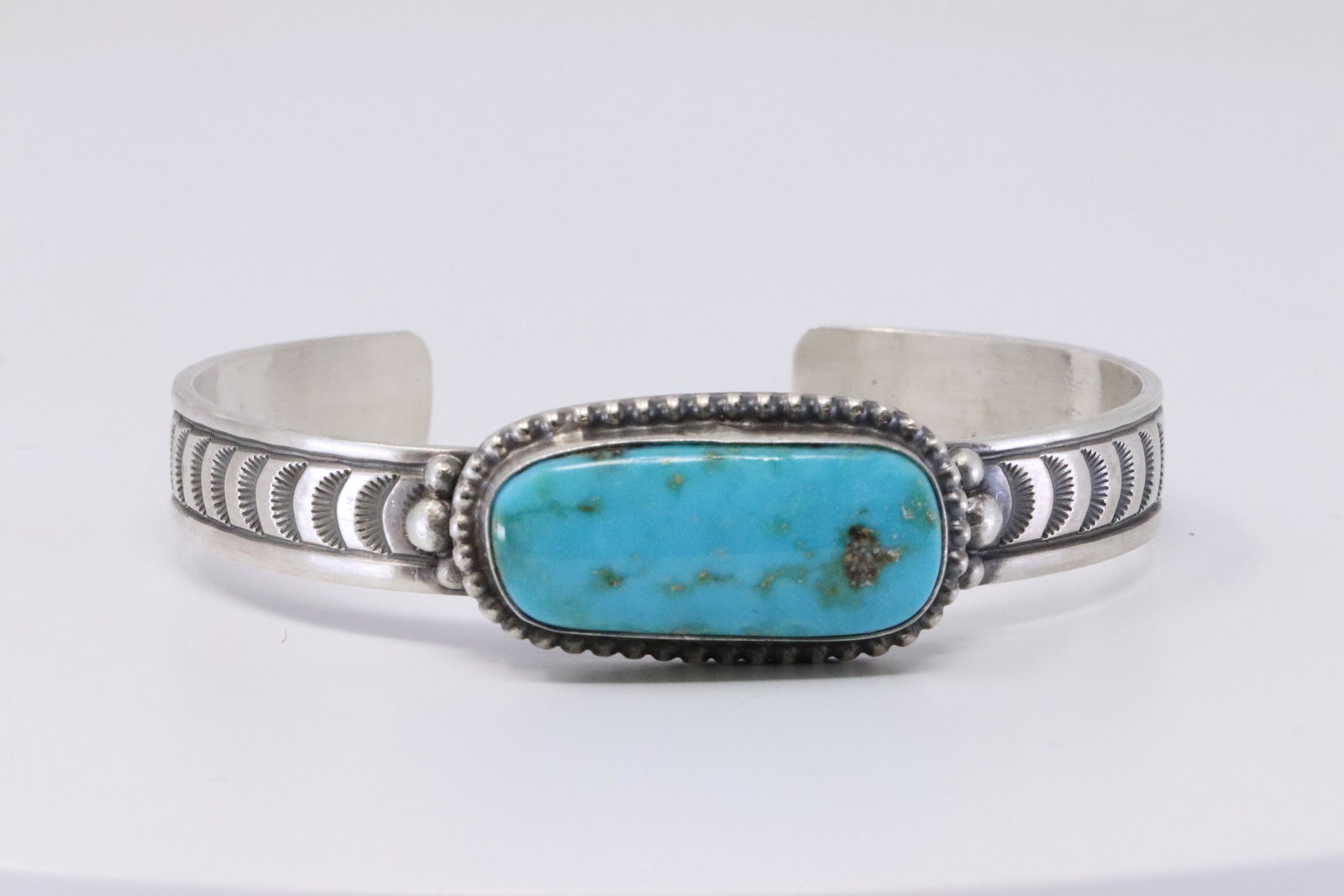 Native American Navajo Handmade Sterling Silver: This is a Native American Navajo Handmade Sterling Silver Turquoise Bracelet by Rick Enriquez.
