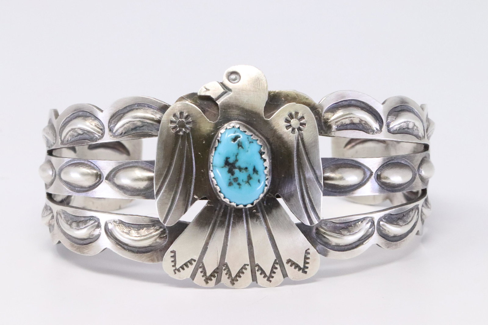 Native American Navajo Handmade Sterling Silver: This is a Native American Navajo Handmade Sterling Silver Turquoise Thunderbird Bracelet by Tim Yazzie.