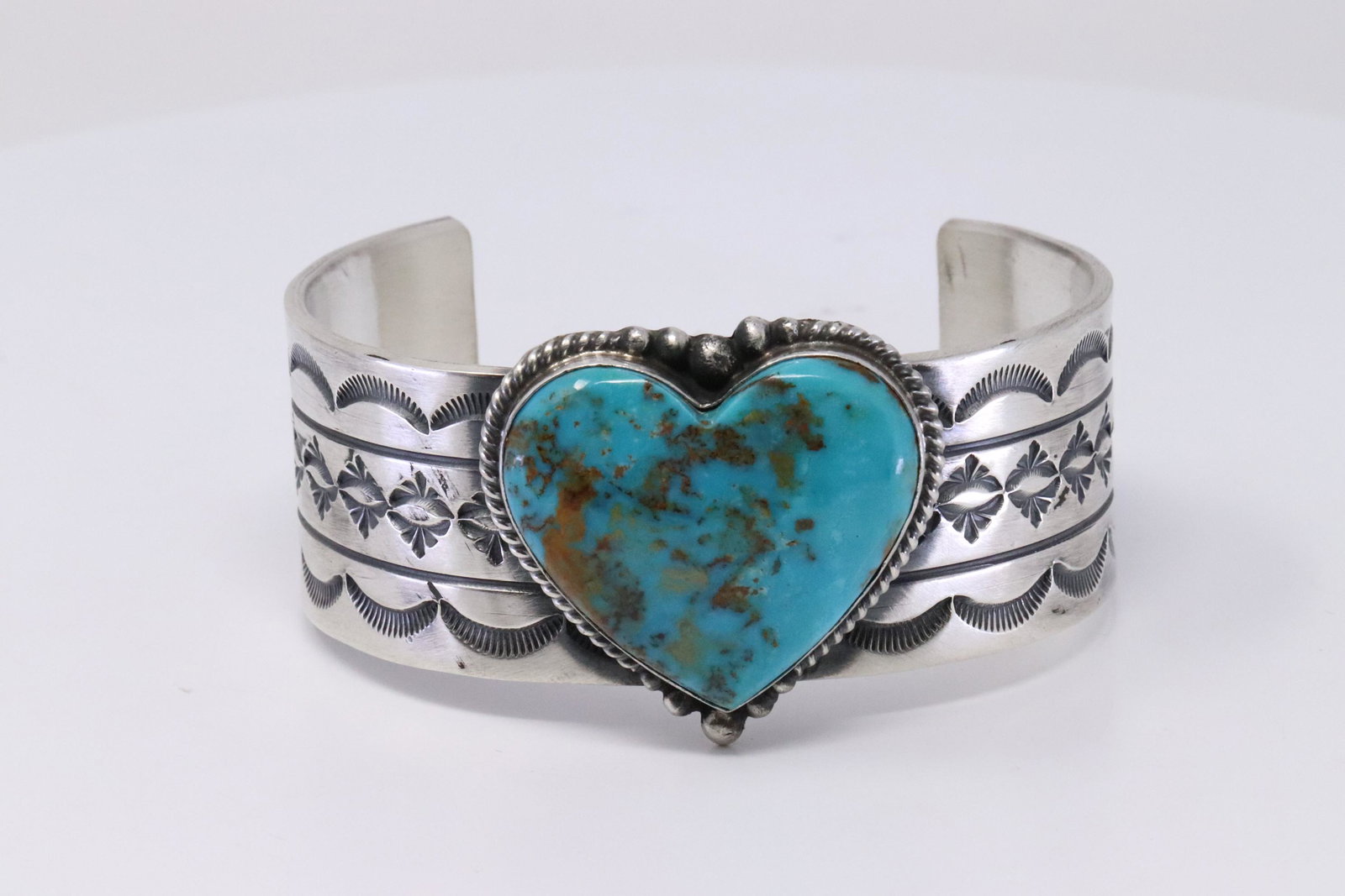 Native American Navajo Handmade Sterling Silver: This is a Native American Navajo Handmade Sterling Silver Turquoise Kingman Heart Bracelet by Rick Enriquez.