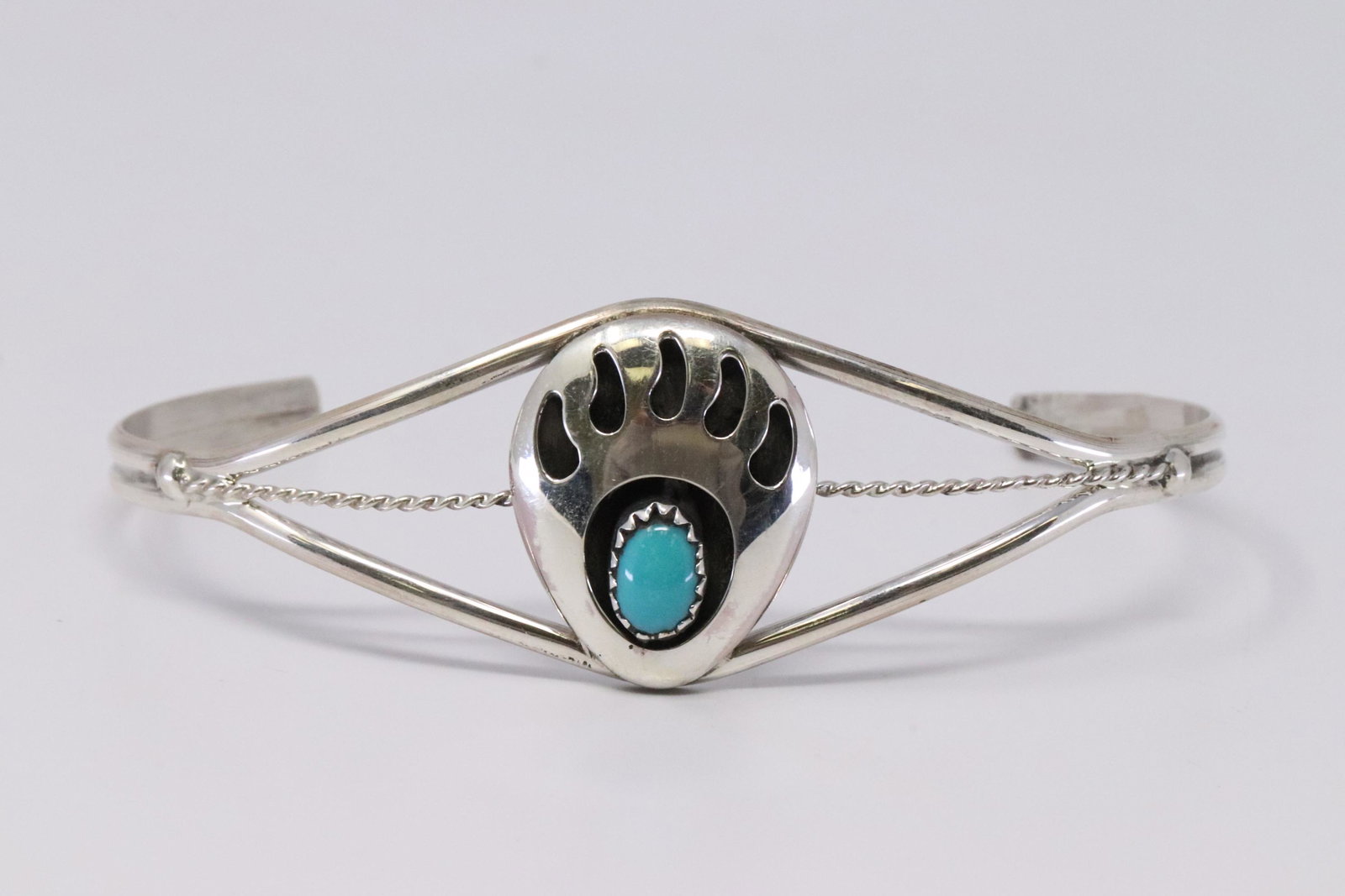 Native American Navajo Handmade Sterling Silver: This is a Native American Navajo Handmade Sterling Silver Turquoise Paw Bear Bracelet by Janice Spencer.