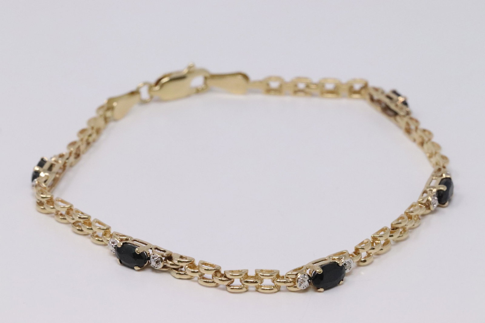 14KT Diamond/Sapphire Bracelet: Ladies 14KT Yellow Gold Diamond Sapphire Bracelet. Bracelet has Diamonds and 5 Sapphires. Bracelet Length: 7.00". Total weight: 4.16 grams. #JJ