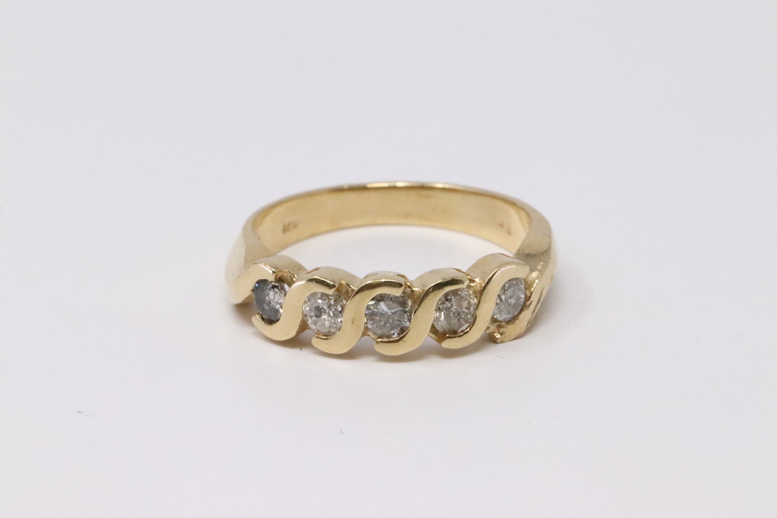 14KT Diamond Ring: Ladies 14KT Yellow Gold Diamond Ring. Ring has a total of 5 Round Diamonds. Ring size: 6.50. Total weight: 3.97 grams. #JJ