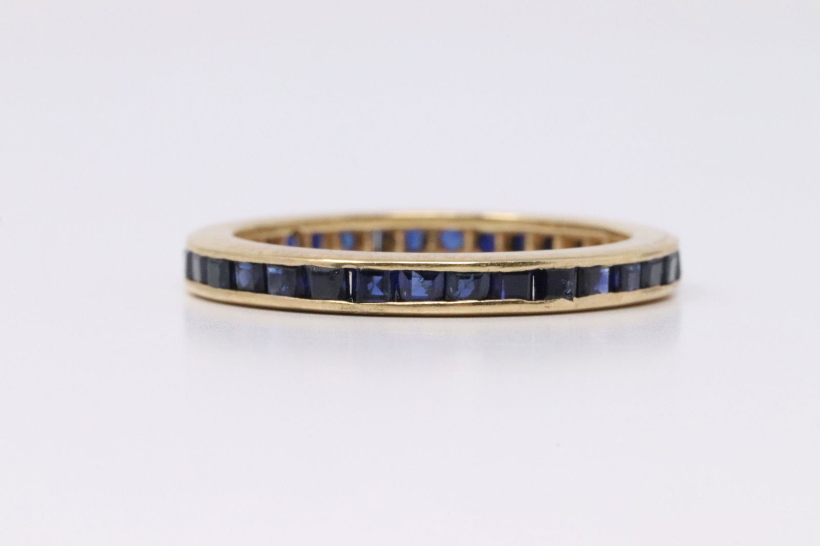 14Kt Yellow Gold Eternity Sapphire Ring. (1 of 3)