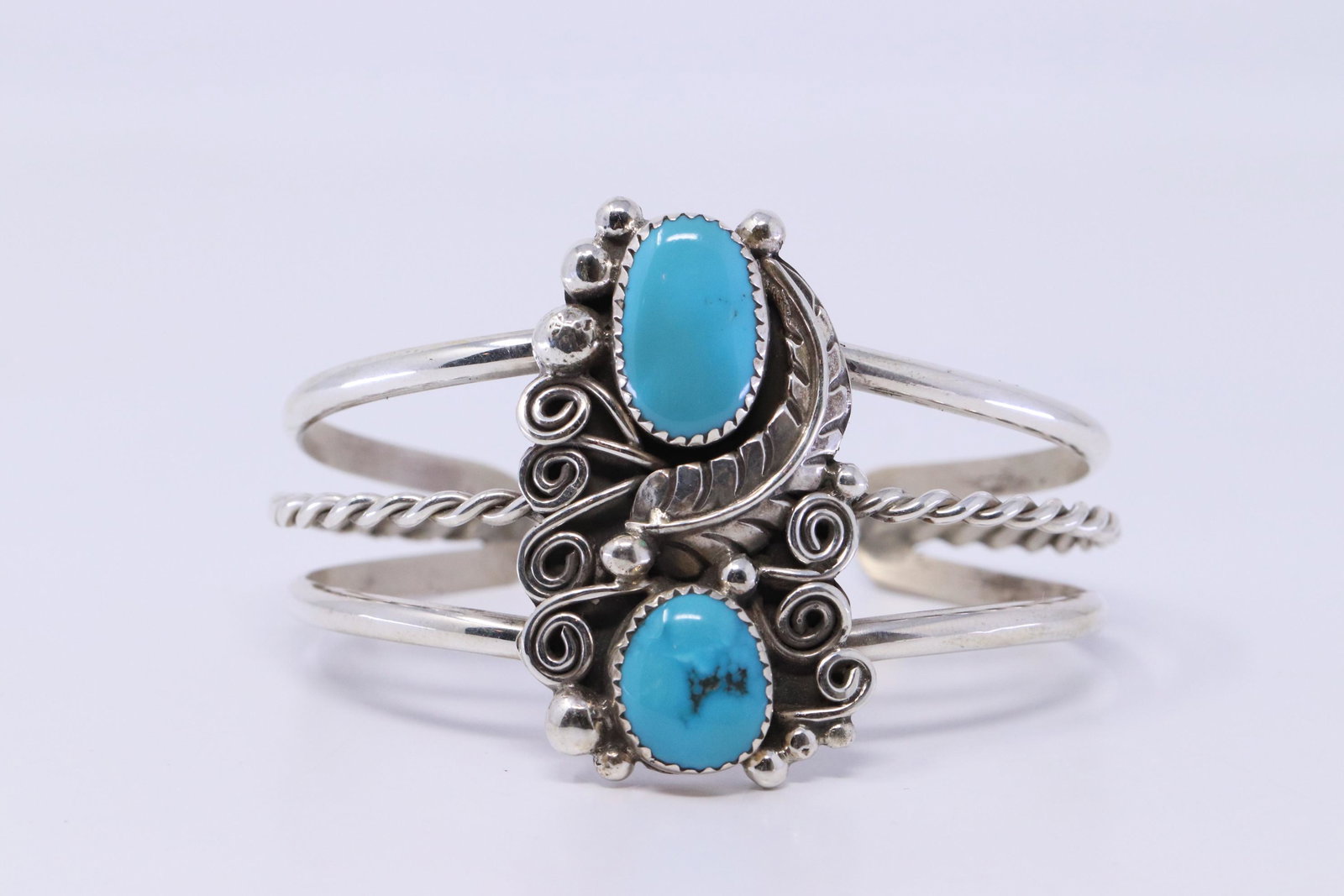 Native American Navajo Handmade Sterling Silver: This is a Native American Navajo Handmade Sterling Silver Turquoise Bracelet By Kenneth Jones. Bracelet size is 5.50.