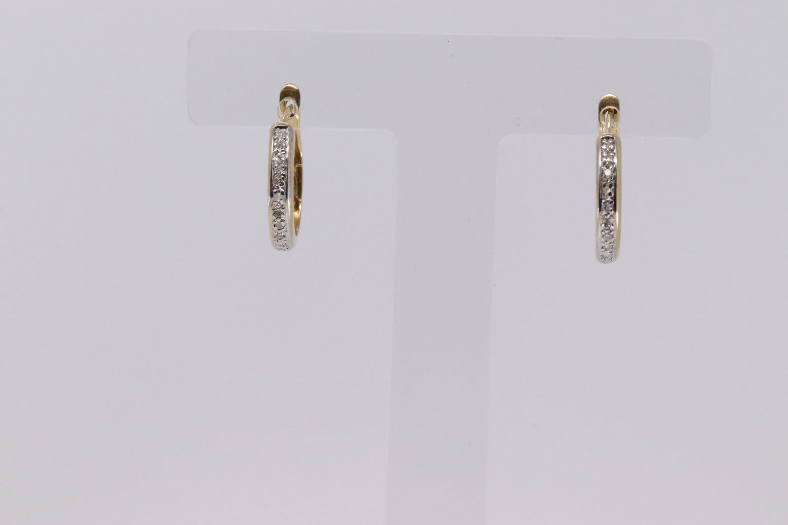 14KT Diamond Huggie Earring. (1 of 3)