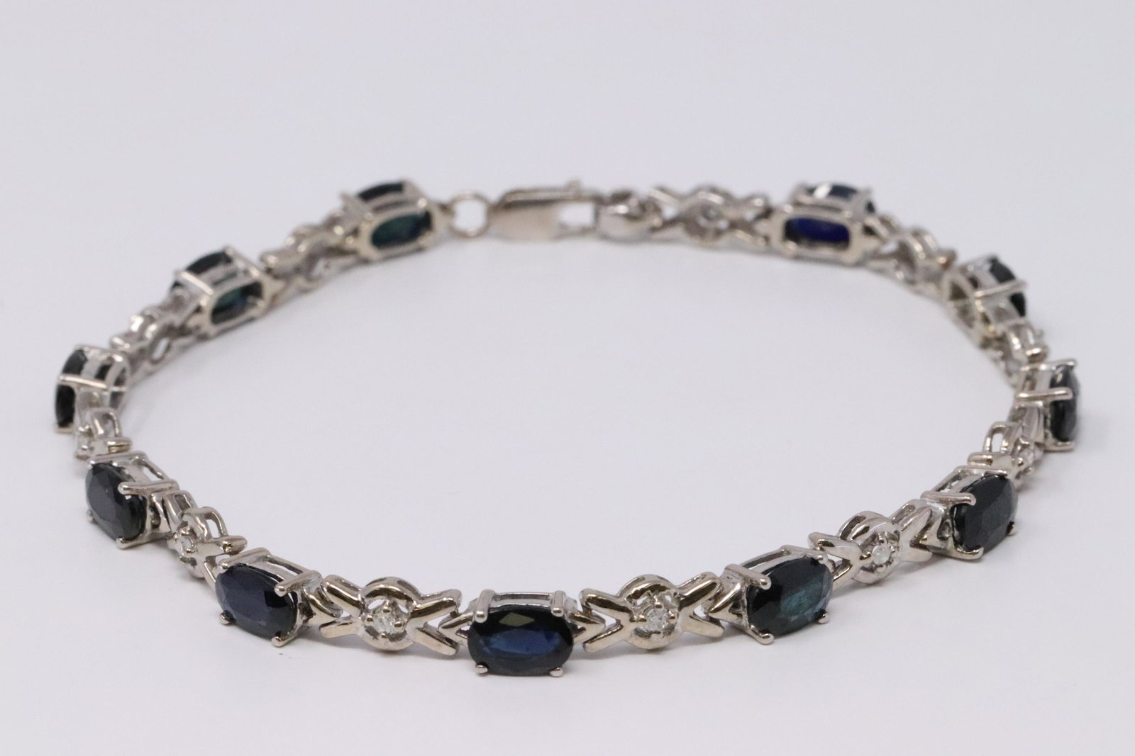 14KT Diamond/Sapphire Bracelet: Ladies 14KT White Gold Diamond Sapphire Bracelet. Bracelet has a total of 11 Round Diamonds and 11 Sapphires. Bracelet Length :7.00". Total weight: 8.00 grams. #JJ