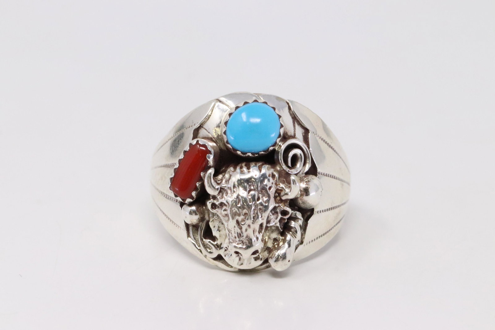 Native America Handmade Navajo Sterling Silver: This is a Native America Handmade Navajo Sterling Silver Turquoise & Coral Buffalo Ring By G. Ring size: 11.50.