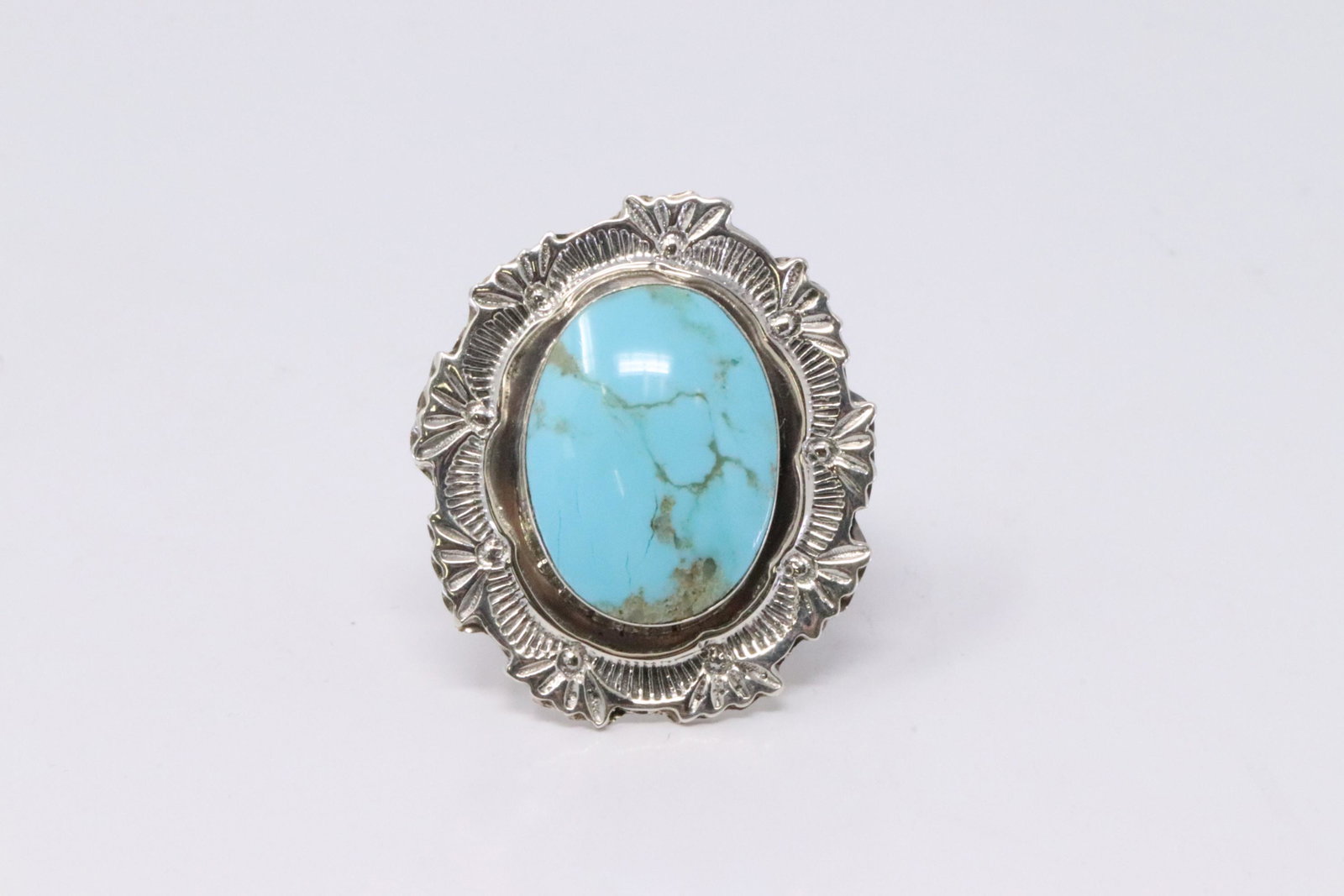 Native American Navajo Handmade Sterling Silver: This is a Native American Navajo Handmade Sterling Silver Turquoise Stamped Ring By Daniel Benally. Ring size: 6.00.