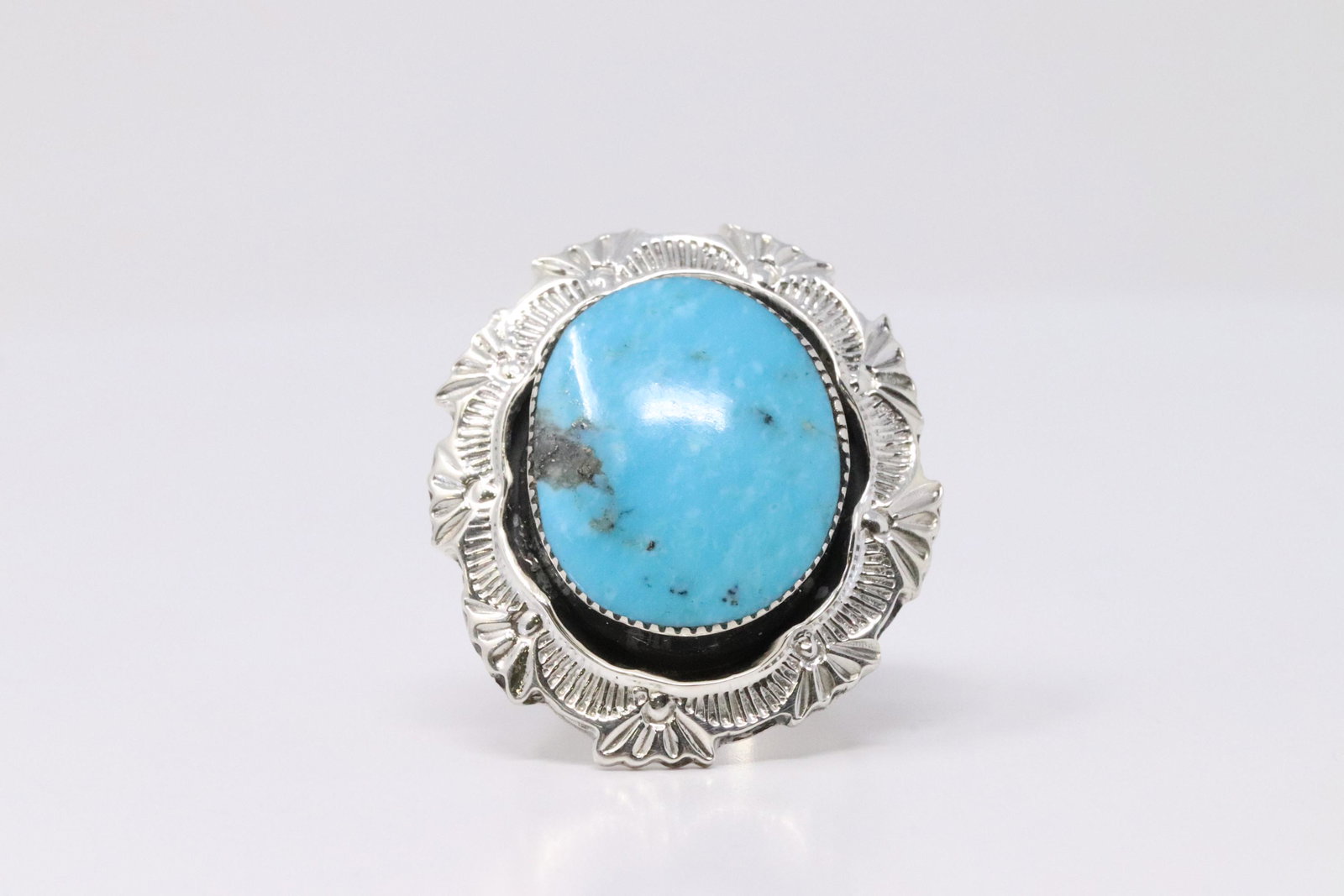 Native American Navajo Handmade Sterling Silver: This is a Native American Navajo Handmade Sterling Silver Turquoise Stamped Ring By Daniel Benally. Ring size: 5.75.